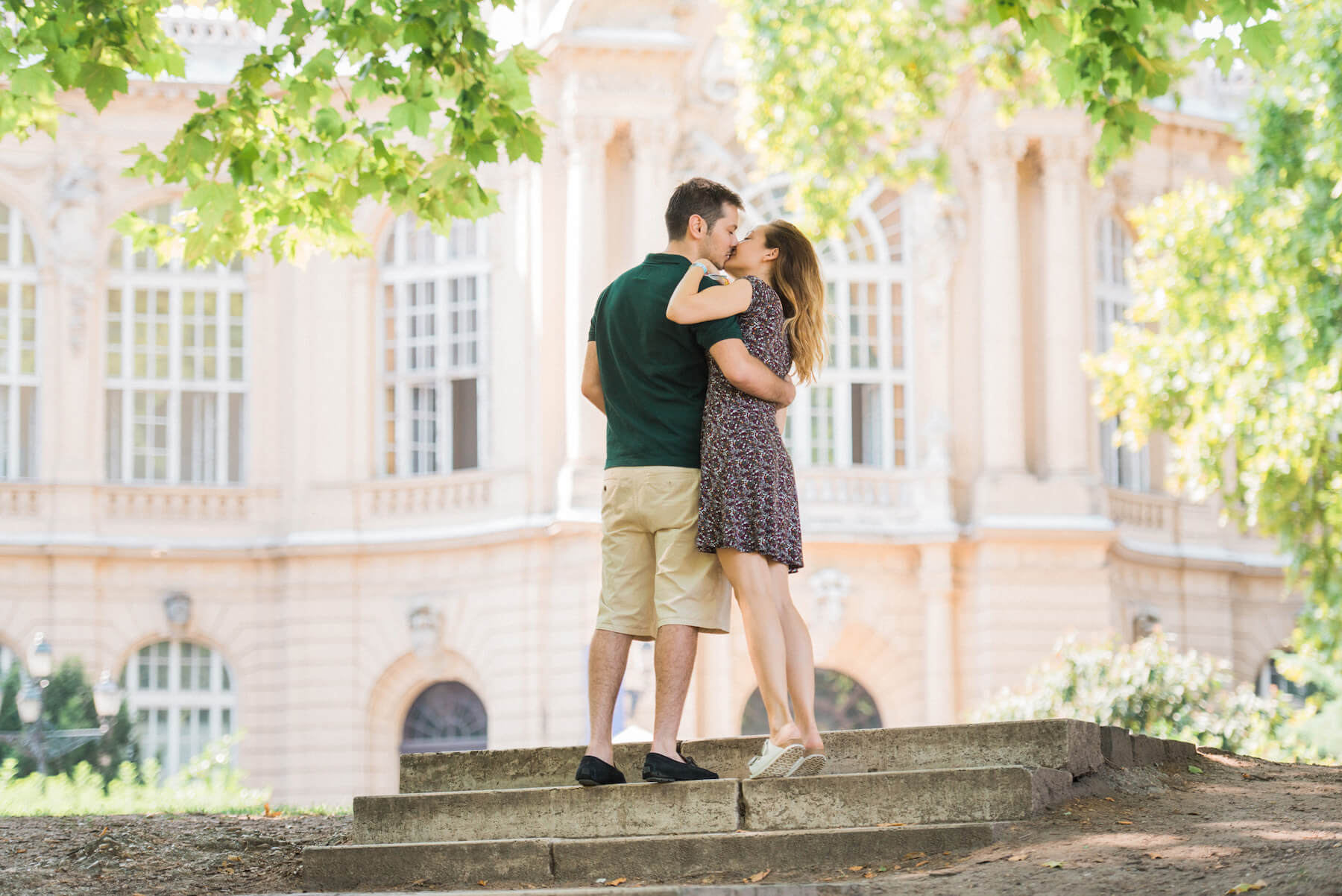 Couple kissing on steps together on a couples trip in Budapest, Hungary