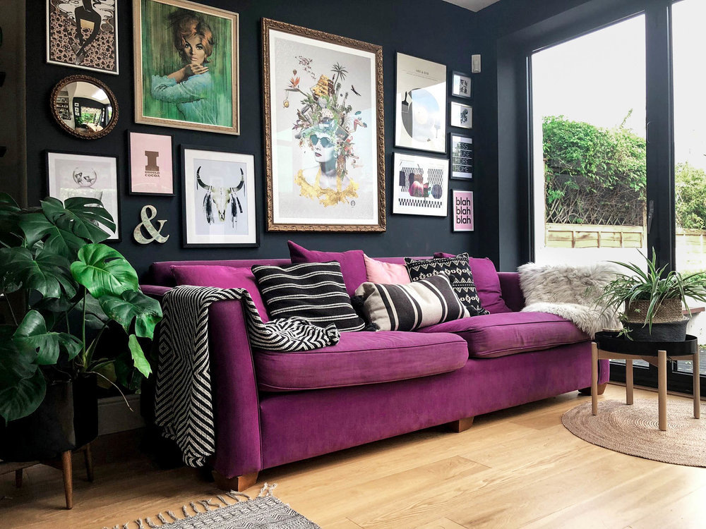 Purple couch and gallery wall in a home