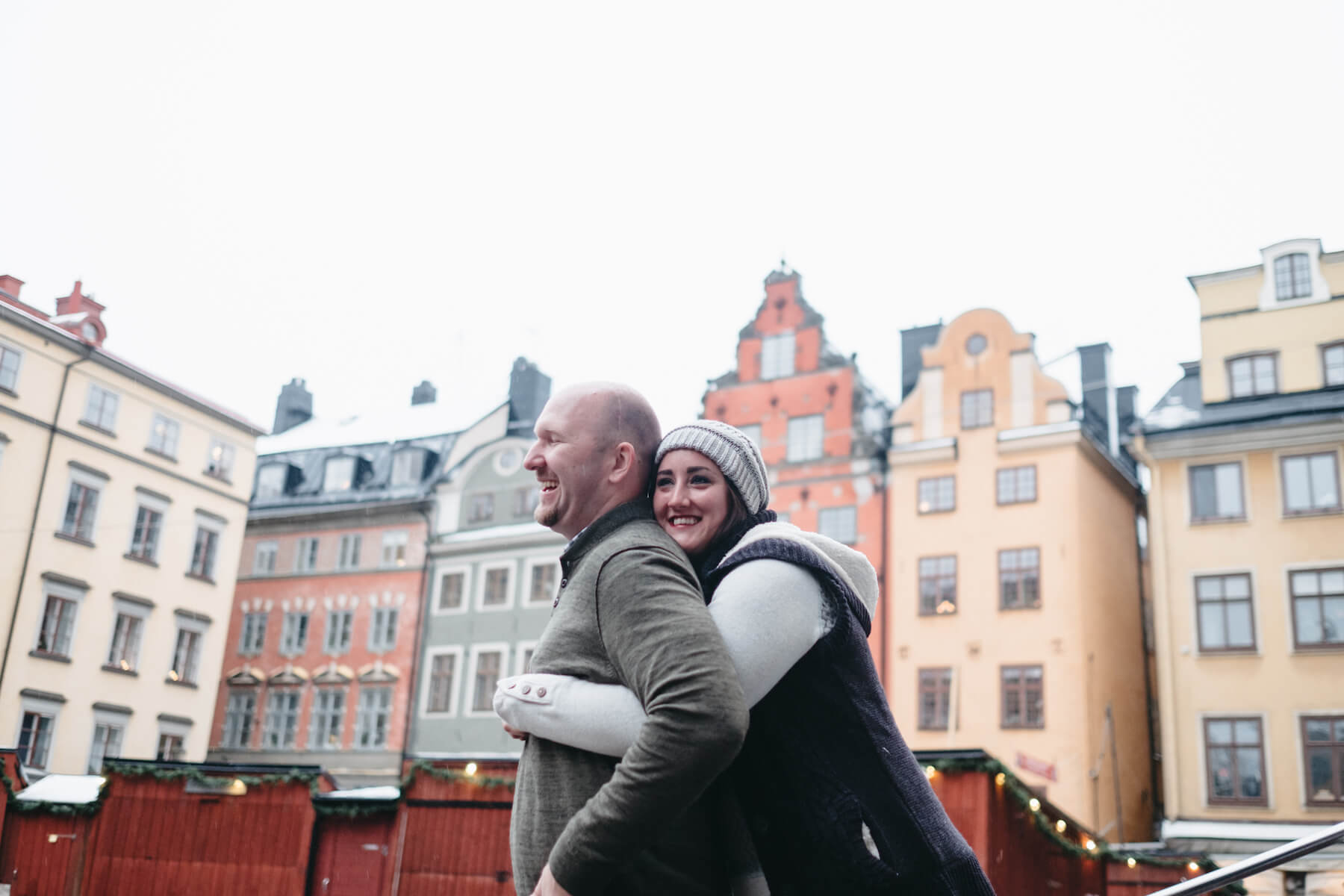 Woman hugging her partner and they are both smiling in Stockholm, Sweden