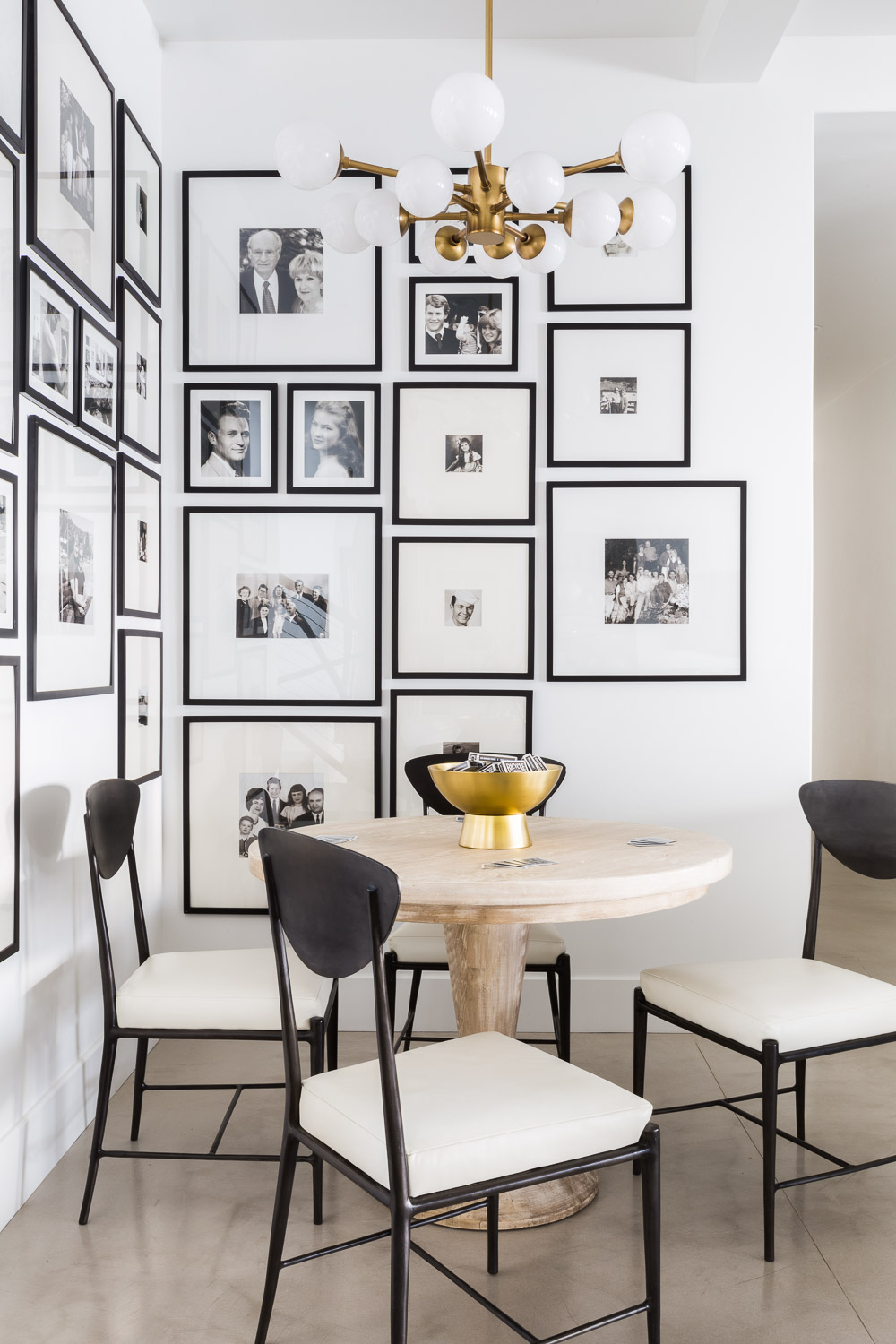 Gallery wall of photos in dining room