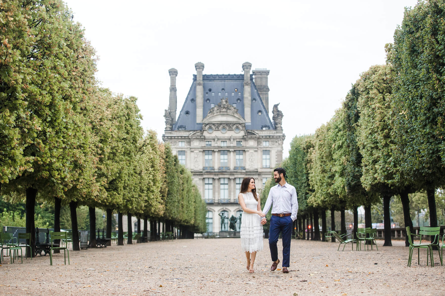 Couple walking in the park on a couples trip in Paris, France