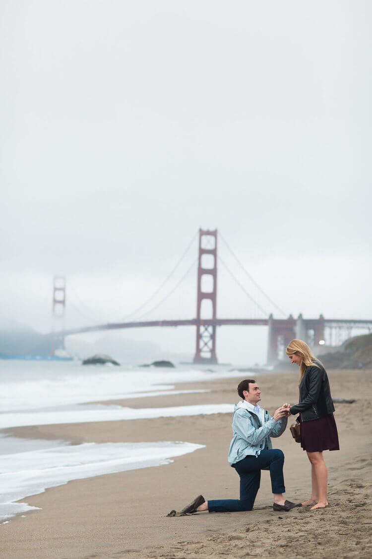 Man proposing to his partner at Baker's beach in San Francisco, California USA