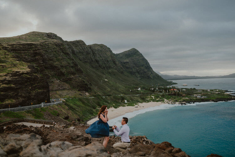 Woman shocked and happy at her partner's surprise proposal at Lanai Lookout in Honolulu, Hawaii USA