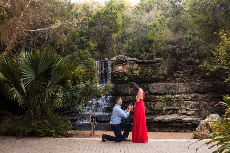 Man proposing to his partner in a park in Austin, Texas USA