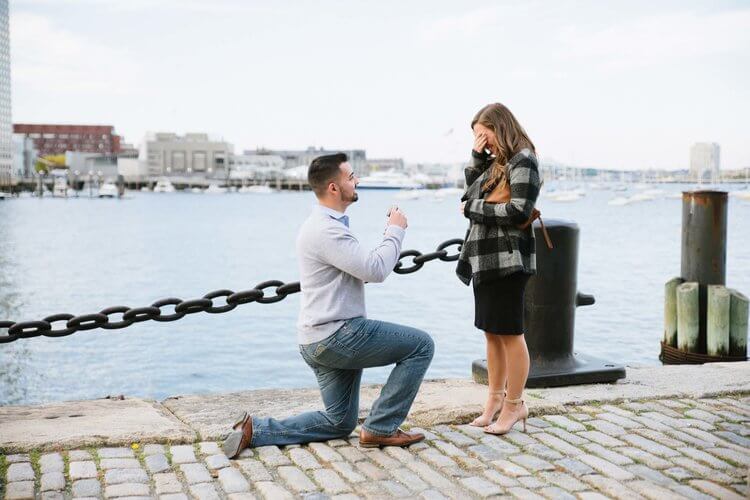 Woman crying of happiness as her partner proposes to her in Boston, USA