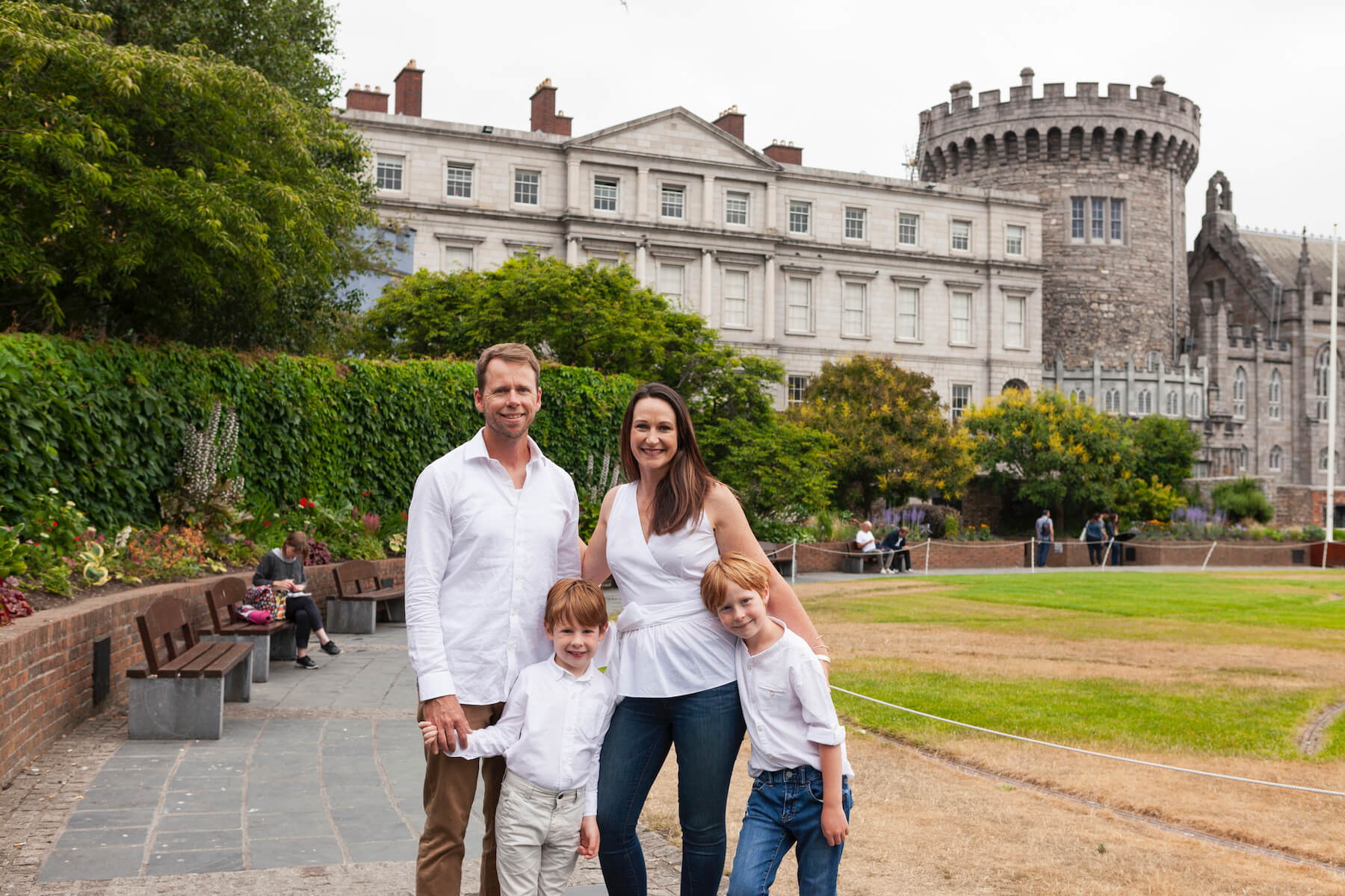 Family standing in front of St Patrick's Cathedral & Dublin Castle Dublin, Ireland 