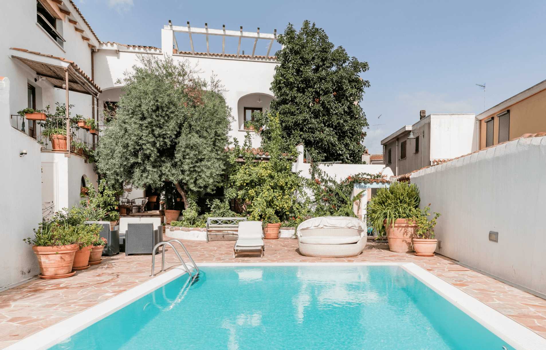 a picture of a pool and outdoor space of an airbnb in Sardinia, Italy
