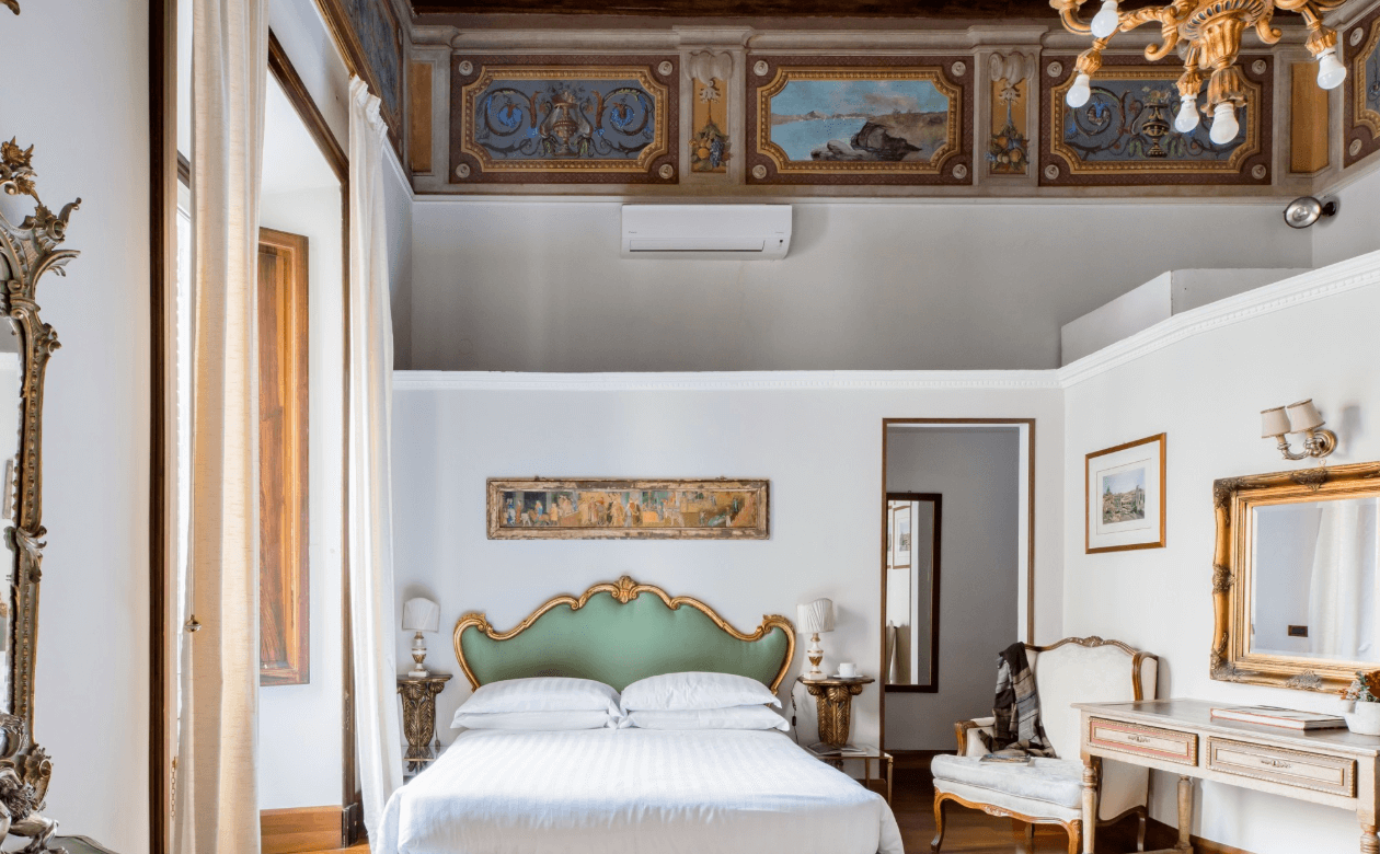 a picture of an airbnb bedroom done in Italian style in Rome, Italy