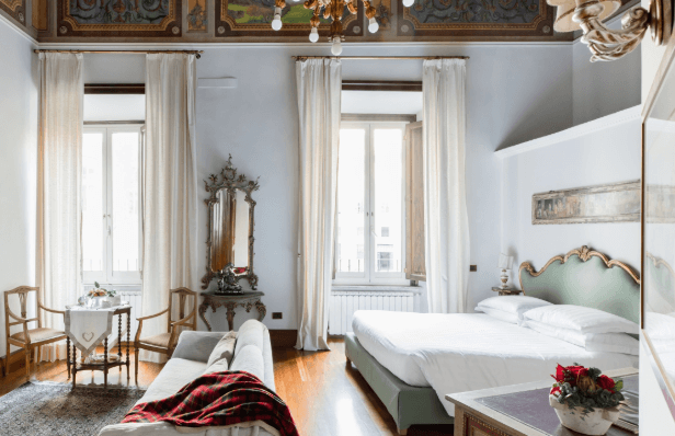 stunning Airbnb bedroom done in the traditional Italian style in Rome, Italy