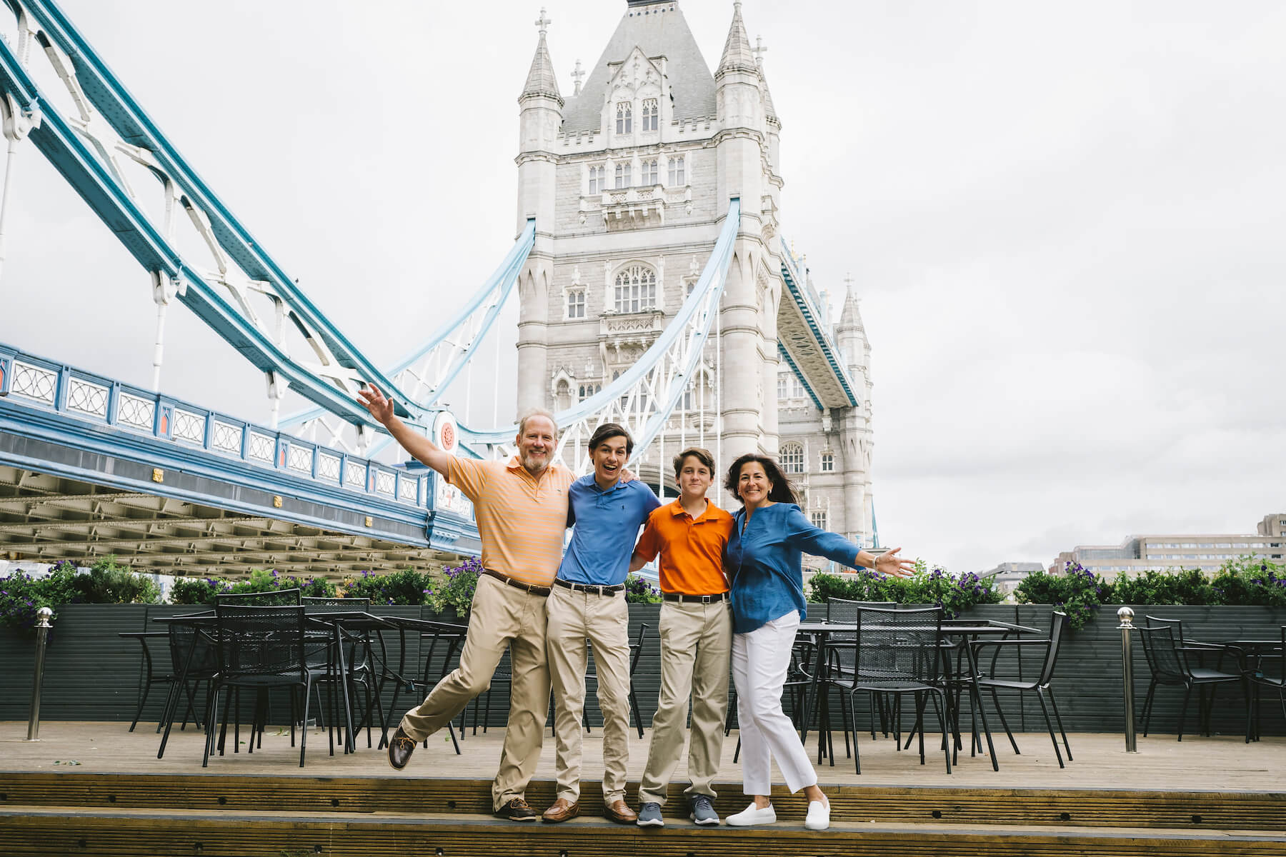 family of four in London, England with the tower bridge in the background