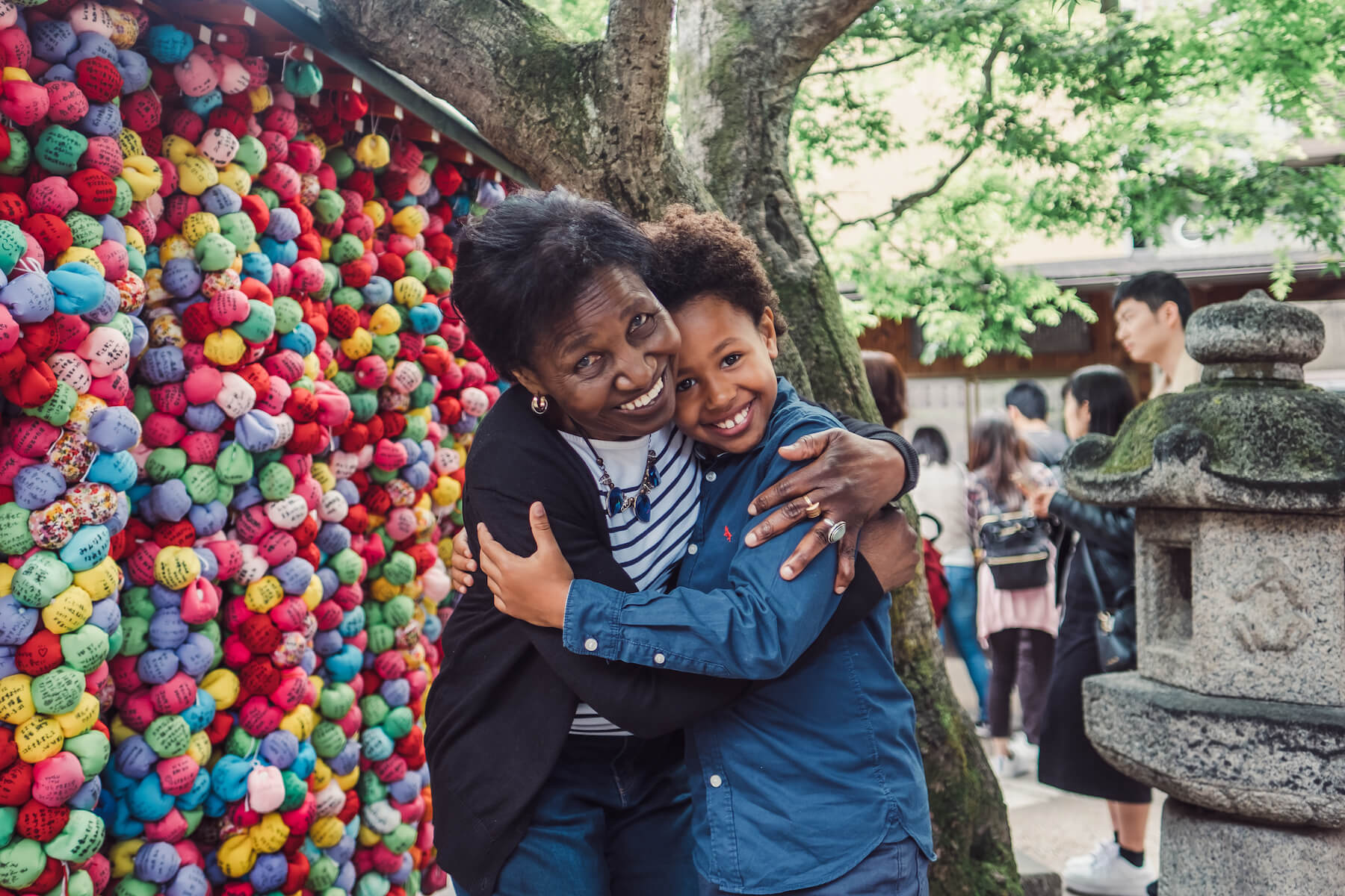 grandma and son hugging each other in Kyoto, Tokyo
