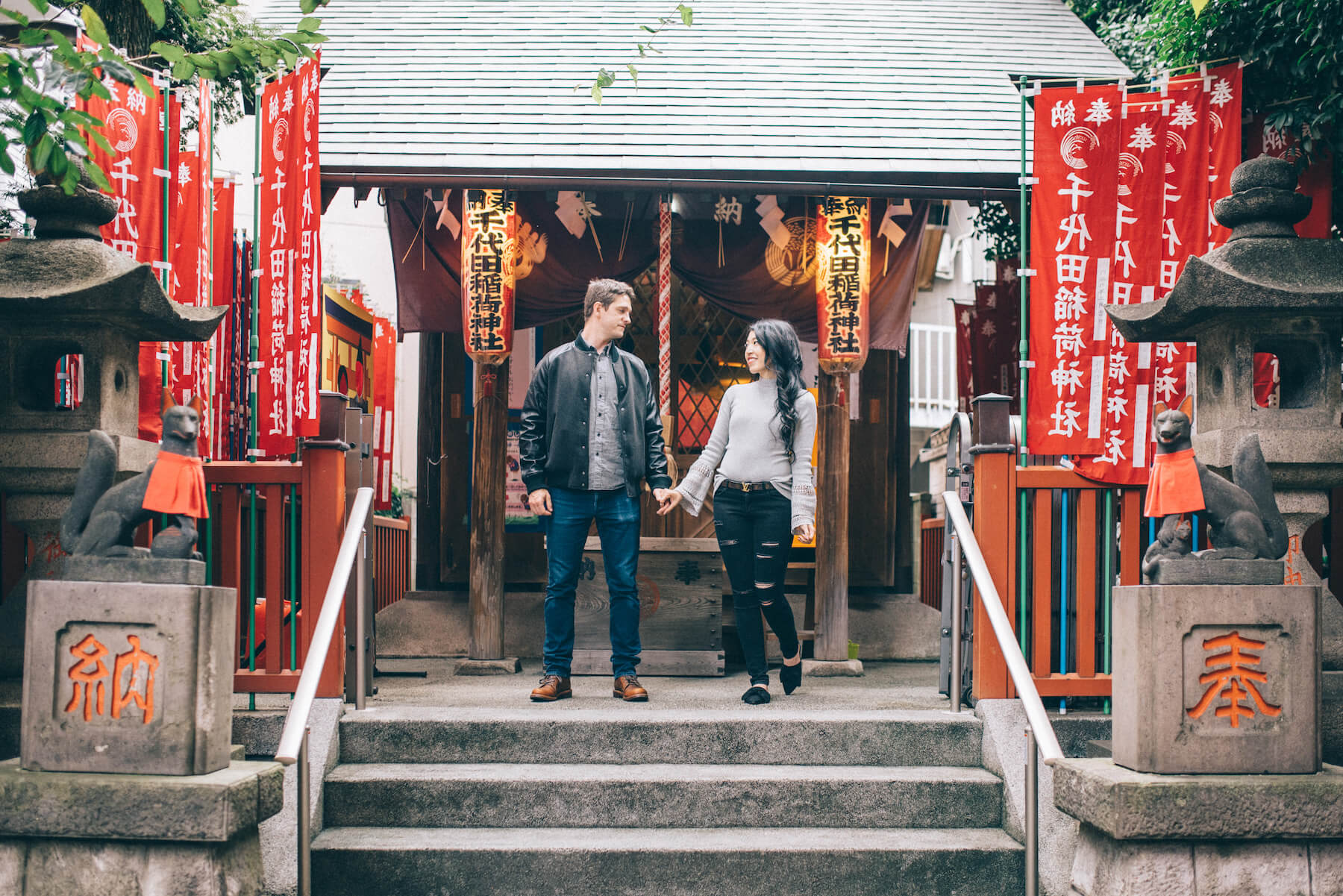 Couple holding hands smiling in Tokyo, Japan