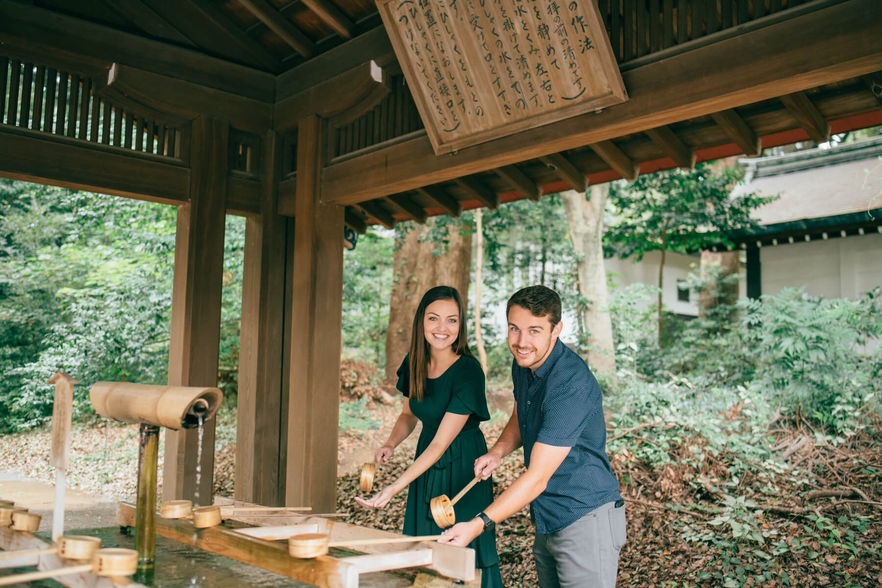 couple getting water at Meiji Shrine, Tokyo Japan