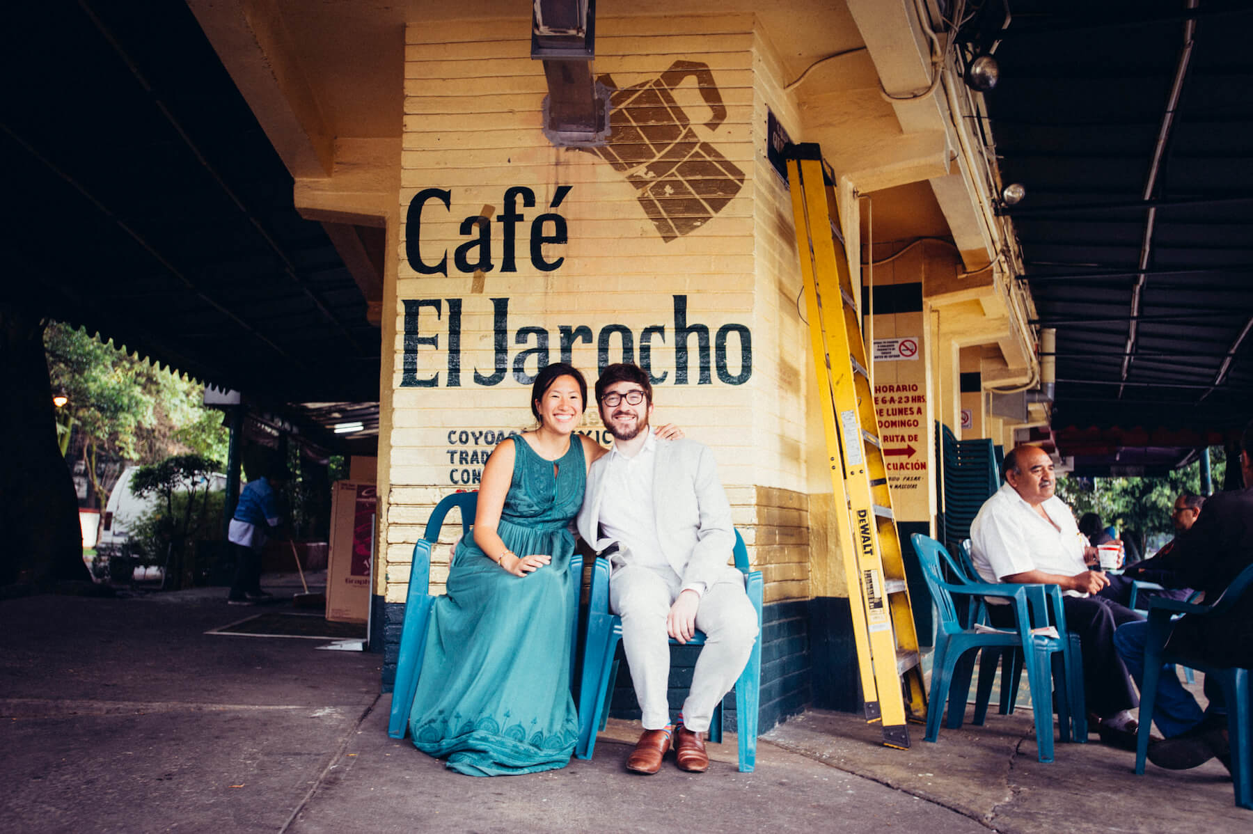 couple in front of a Mexican cafe, sitting down in Mexico City, Mexico