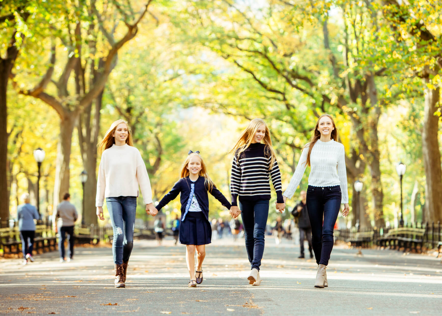 Sisters holding hands in Central Park, New York City, New York