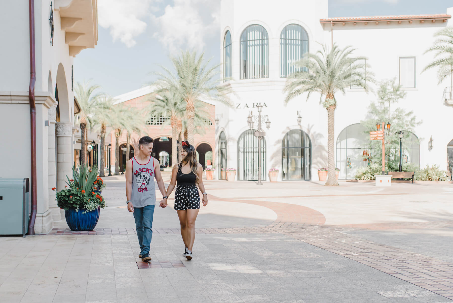 couple walking holding hands in Disney Orlando, Florida
