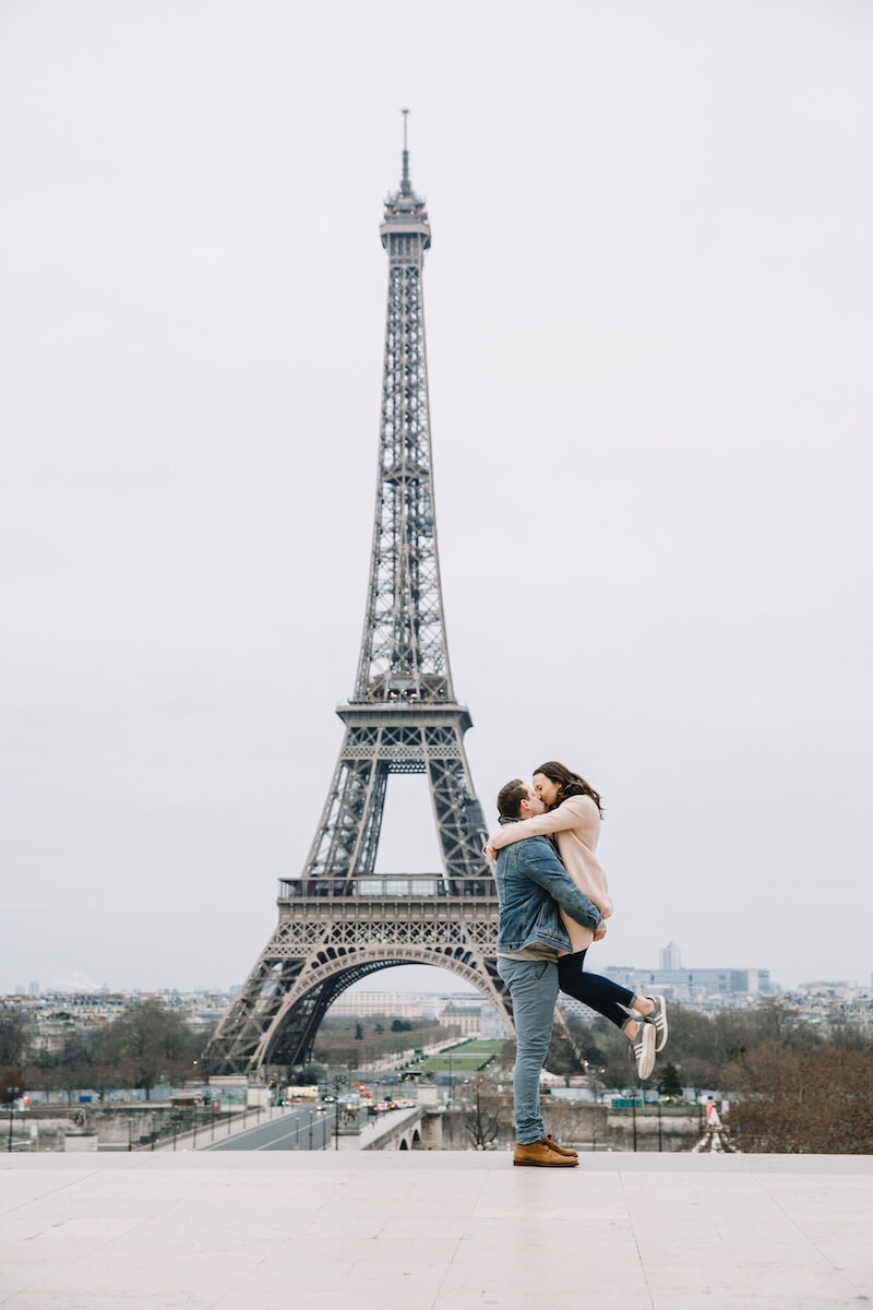 Couple hugging after a marriage proposal in Paris, France