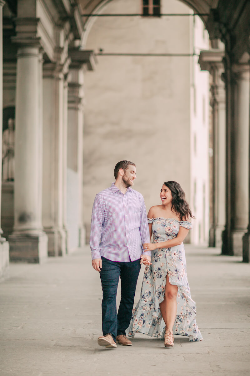 Couple walking near the Duomo church in Florence, Italy