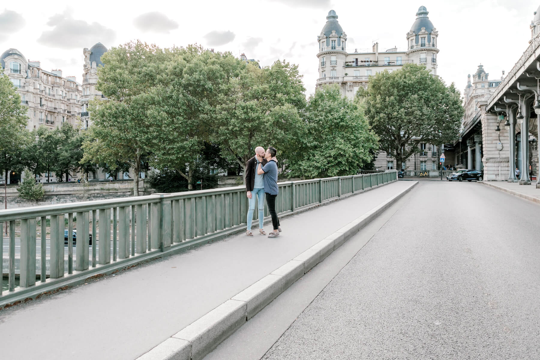 A couple kissing on the road near Eiffel tower in Paris, France 