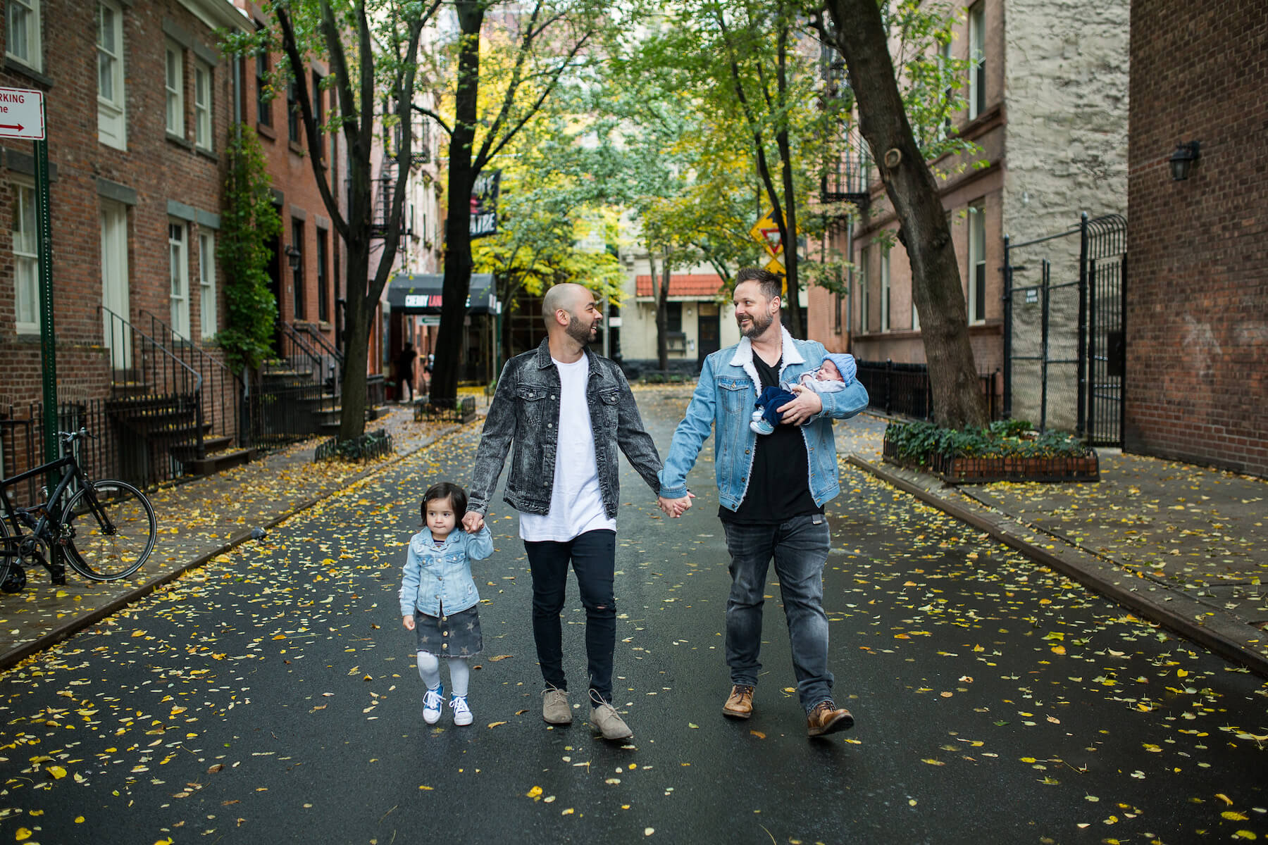 Family with a baby walking in New York City, New York