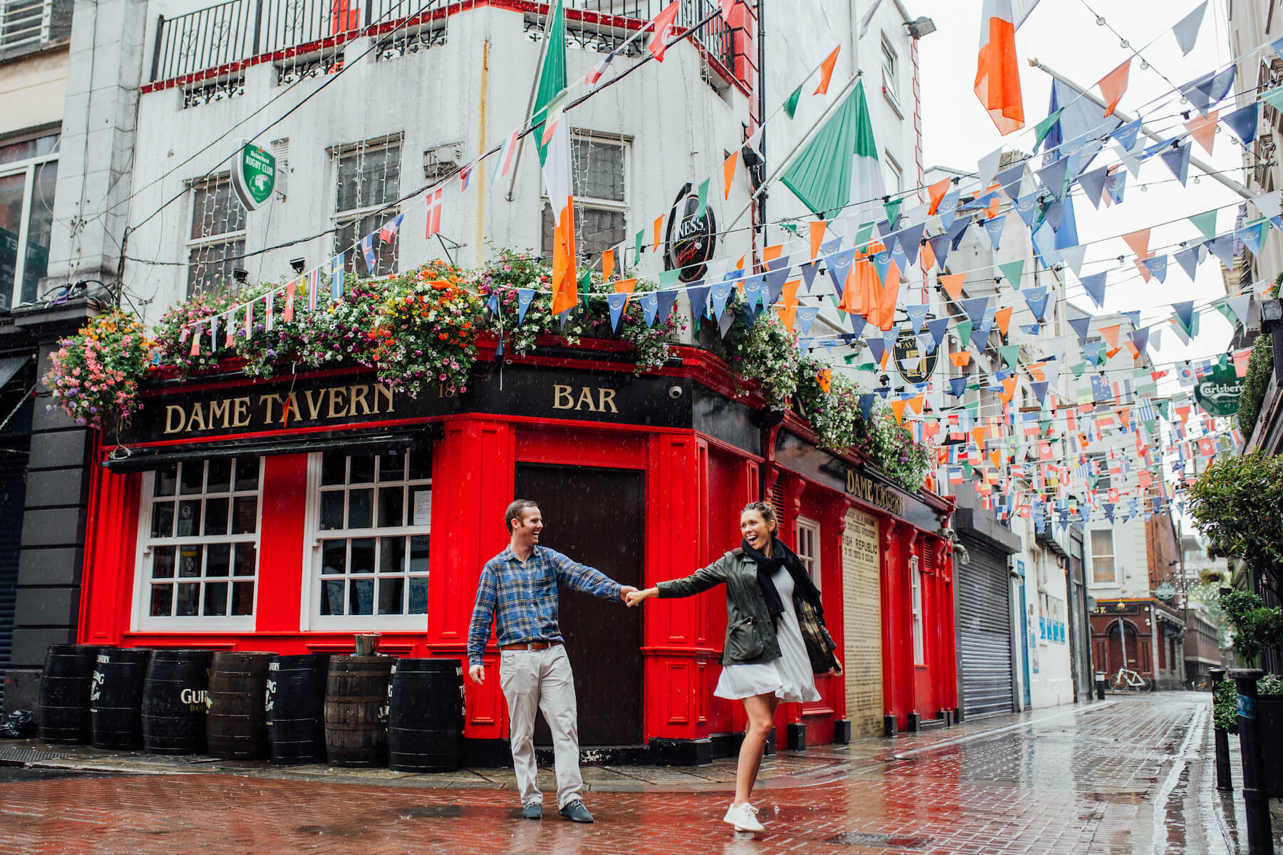 couple dancing in the streets in front of a pub in Dublin, Ireland