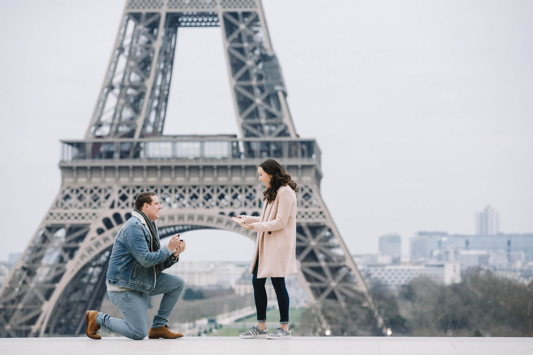 A woman being proposed to, in front of the Eiffel tower in Paris, France