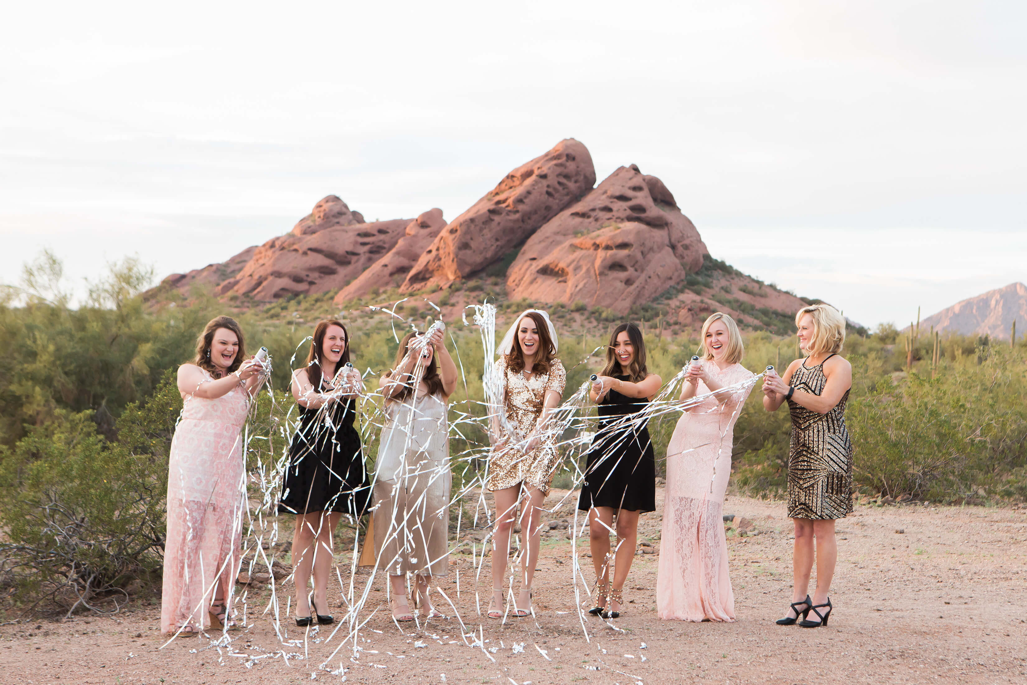 Bachelorette's opening a bottle of champagne in Scottsdale, Arizona