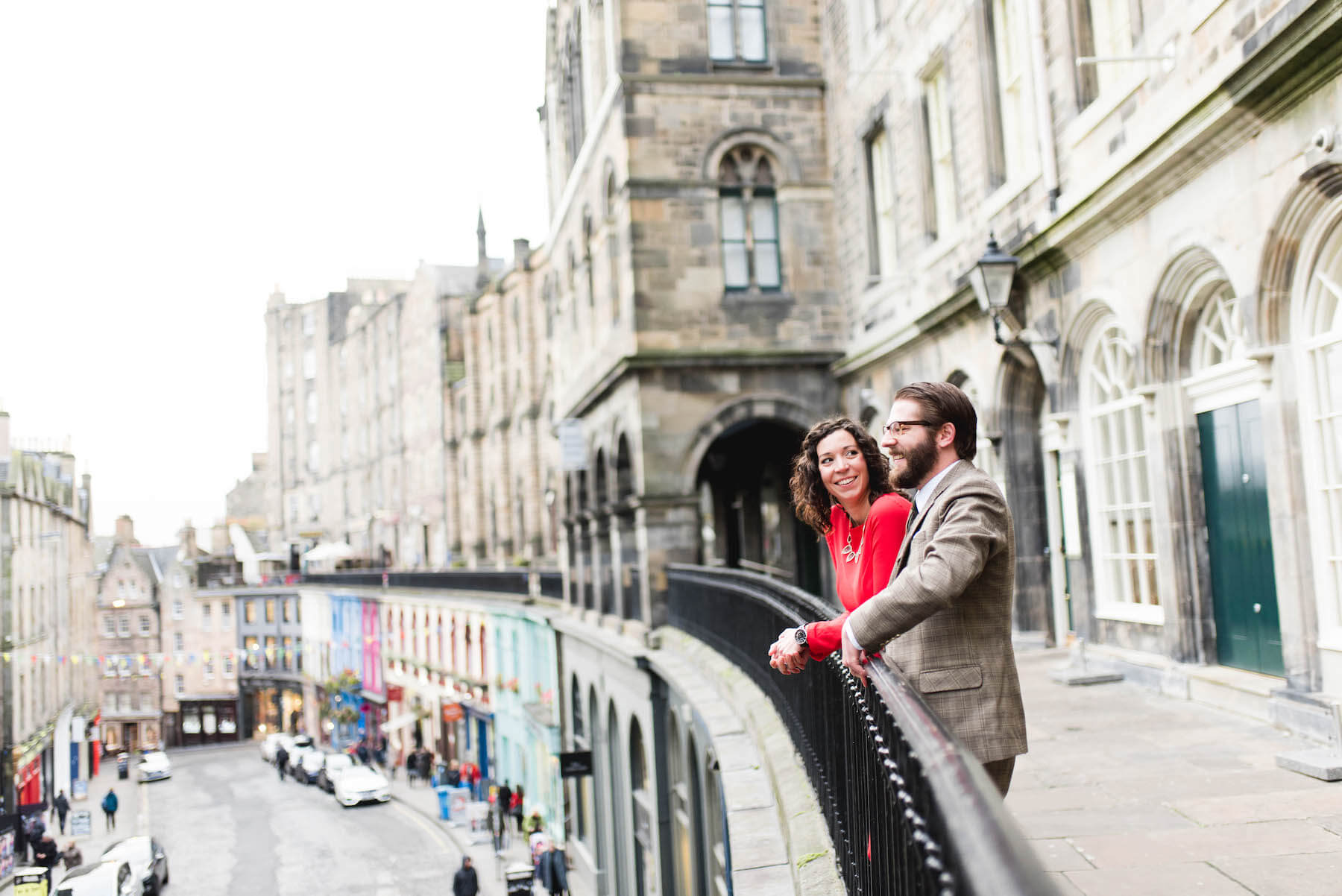 couple standing on a look point, looking at the city of Edinburgh, Scotland