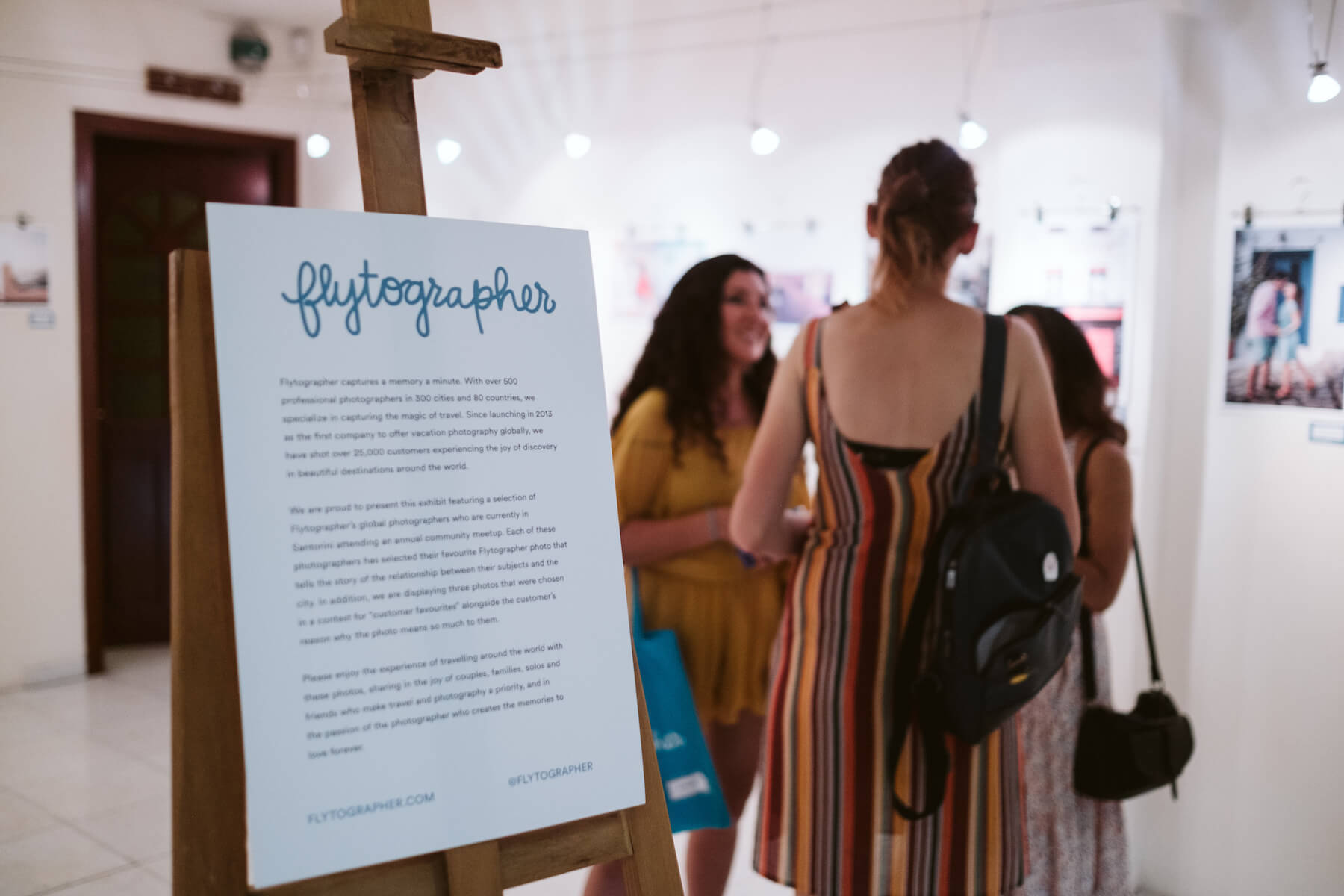 People in a gallery in Santorini, Greece