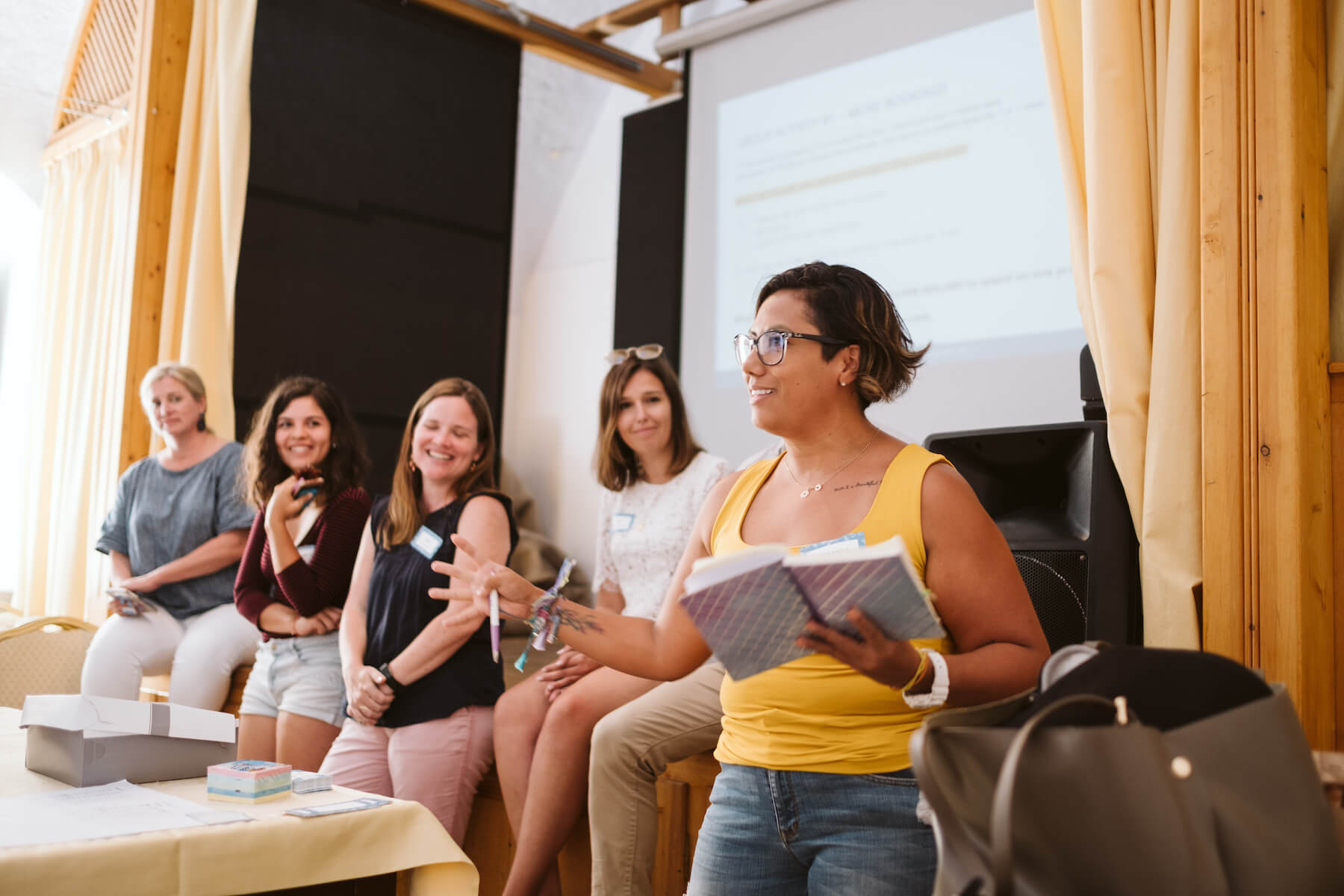 People talking to a group in Santorini, Greece