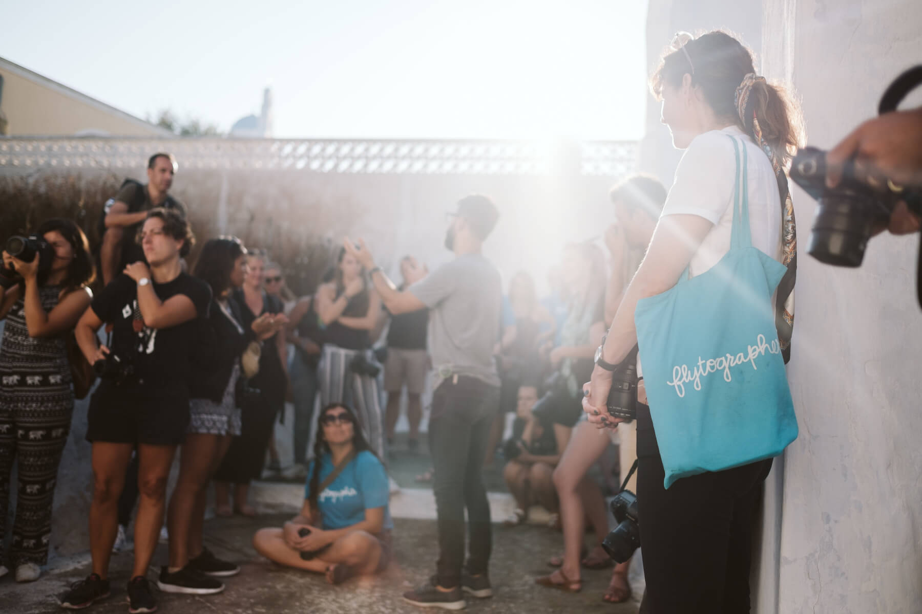 Photographer talking to a group in Santorini, Greece