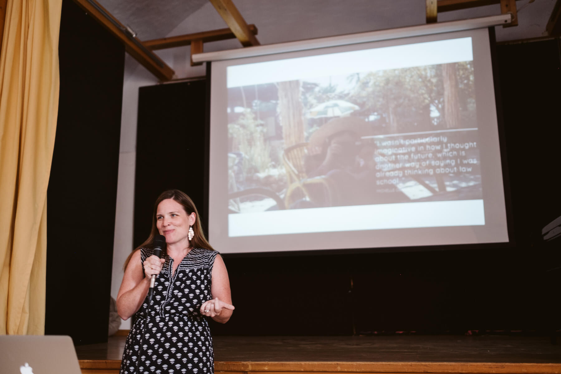Woman presenting to a group in a conference room in Santorini, Greece