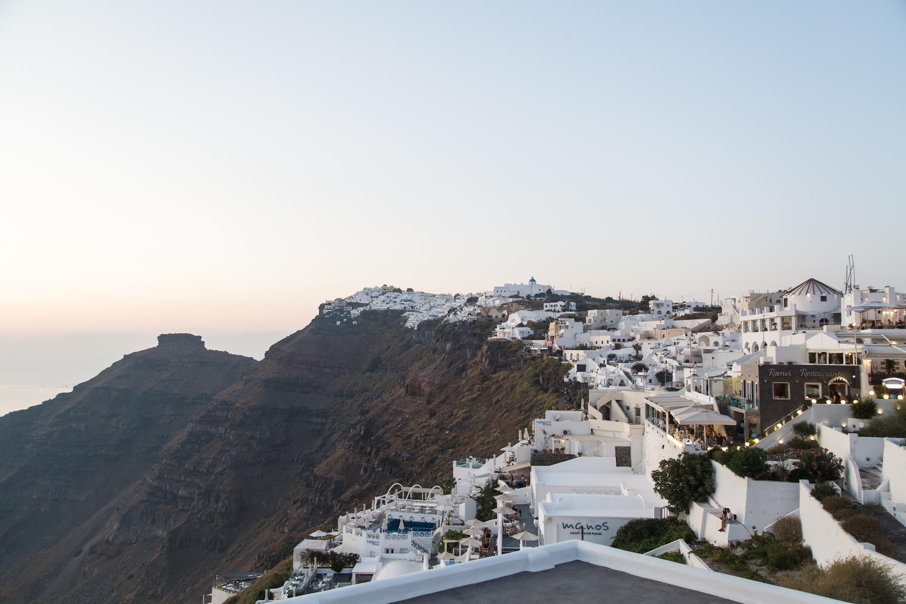 View of houses on a cliff in Santorini, Greece