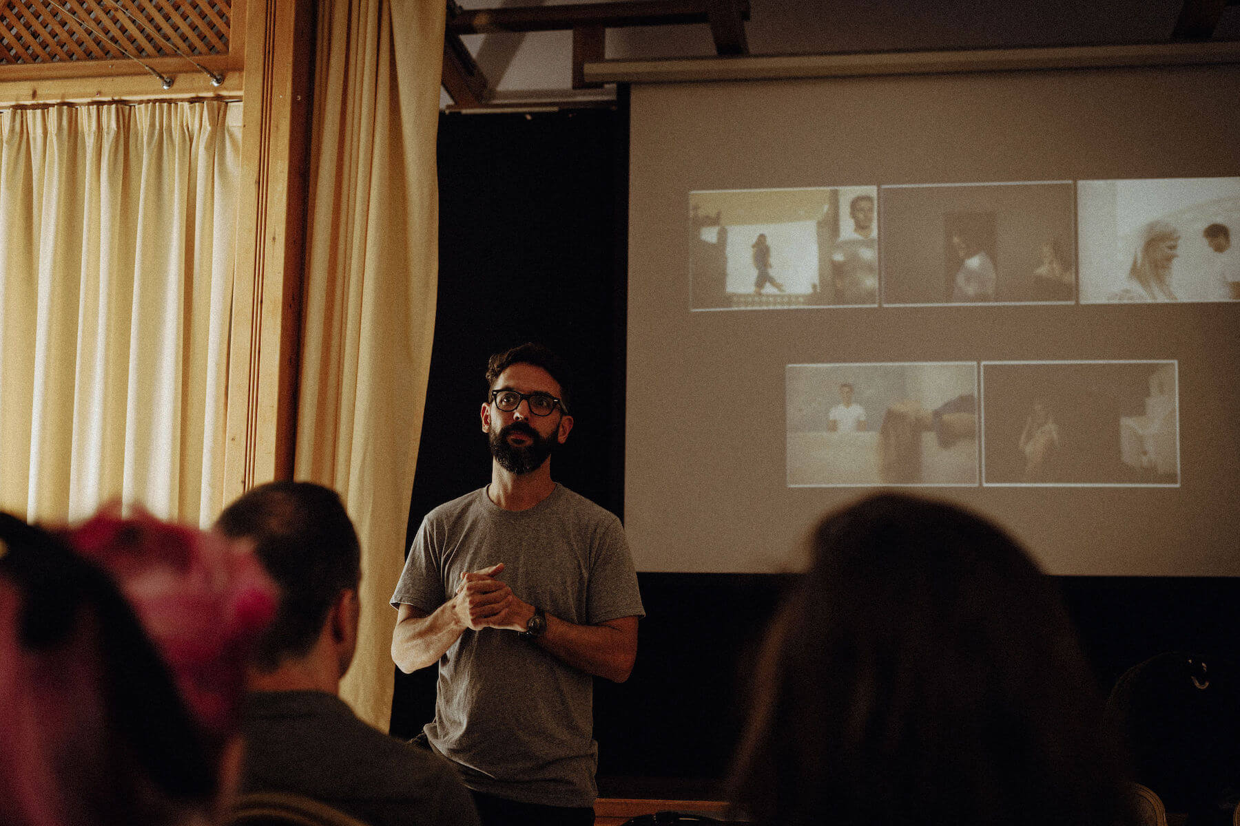 Man talking to a group in a conference room in Santorini, Greece
