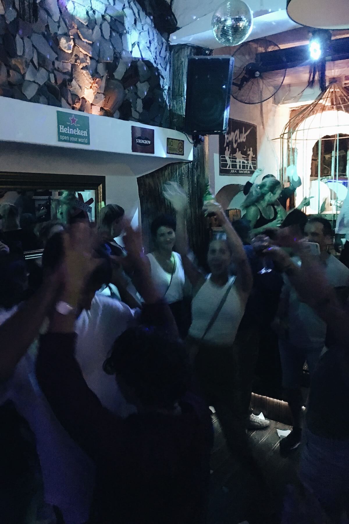 People dancing in Santorini, Greece.