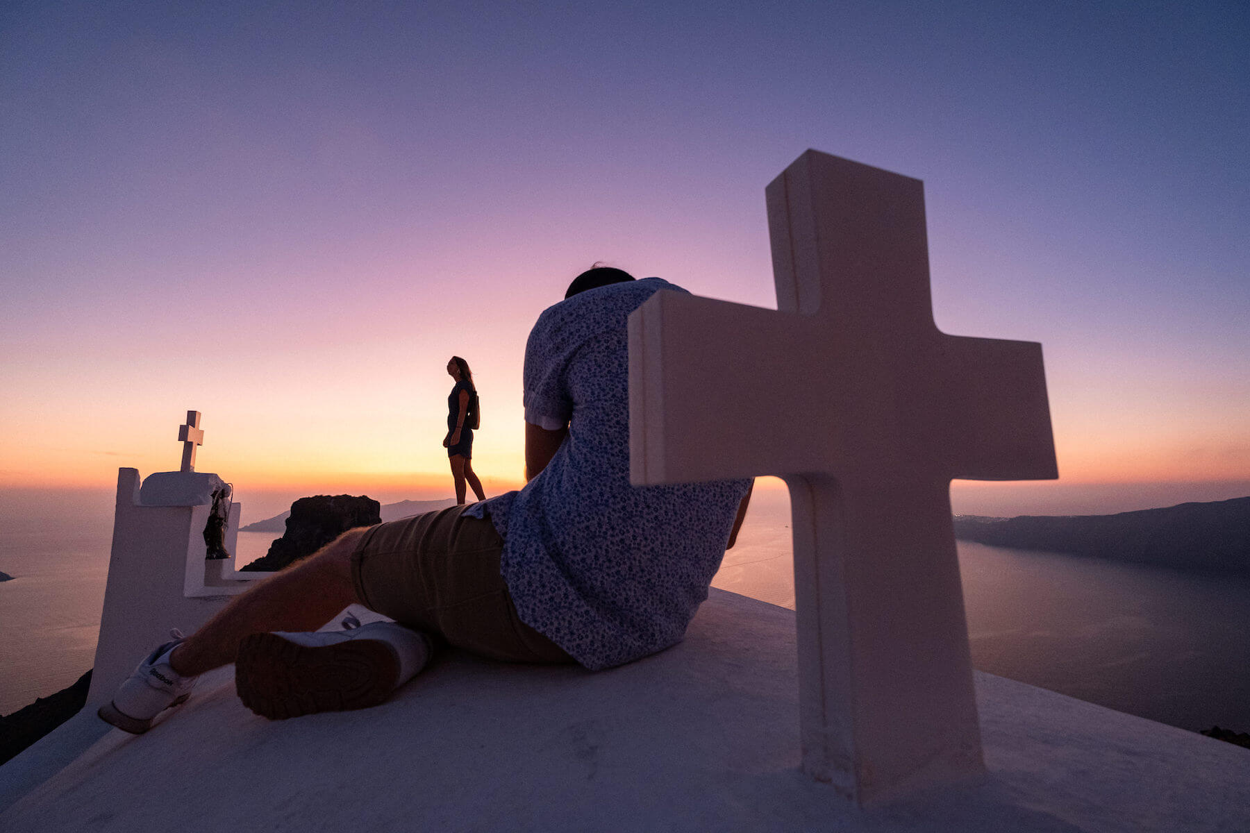 Photographers shooting models during sunset in Santorini, Greece