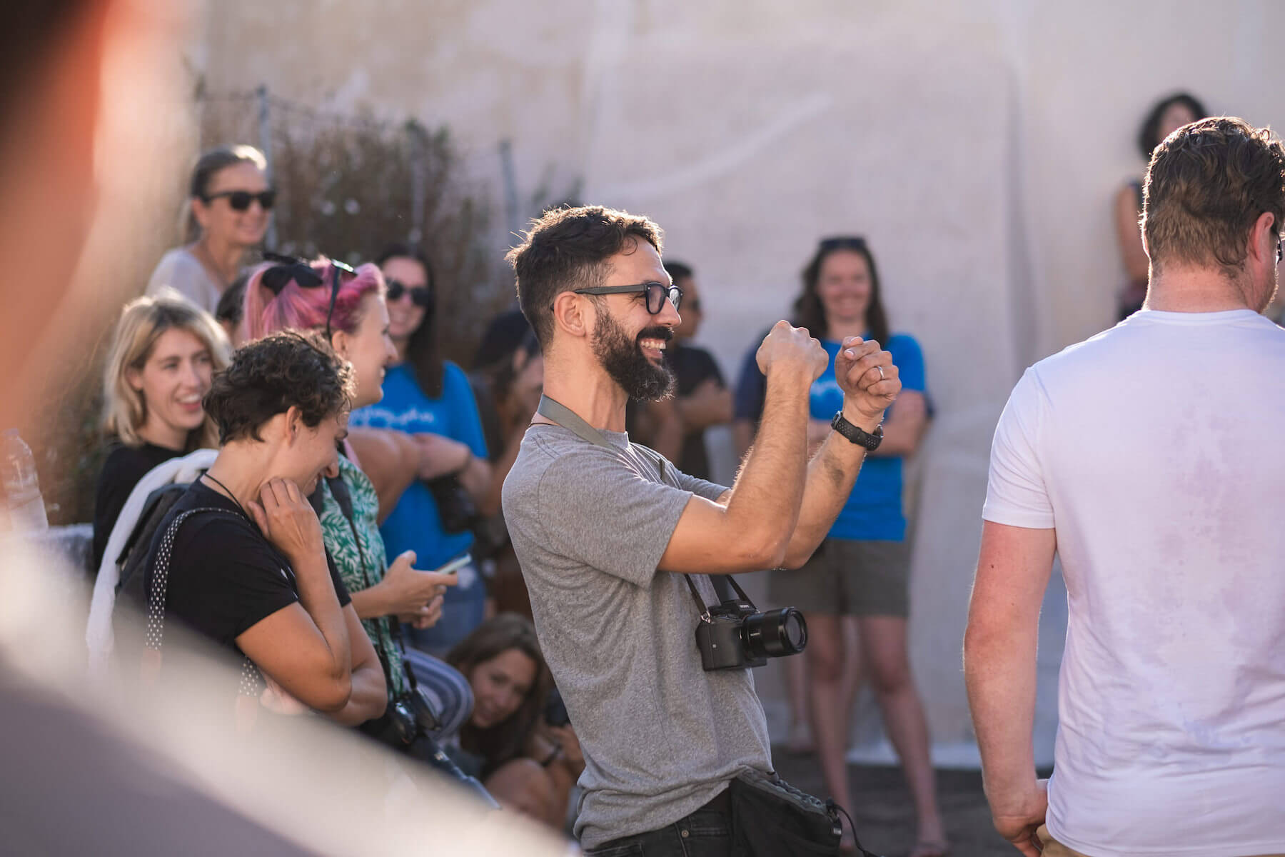 A group of photographers smiling in Santorini, Greece