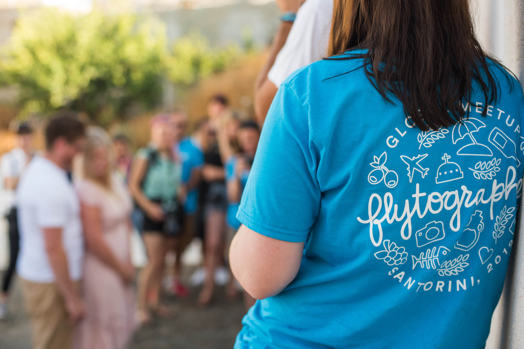 A group of photographers shooting models in Santorini, Greece