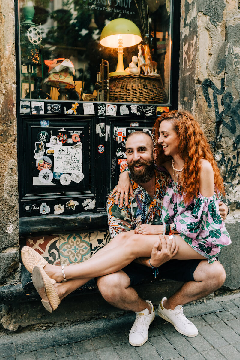 couple sitting on each other in Budapest, Hungary