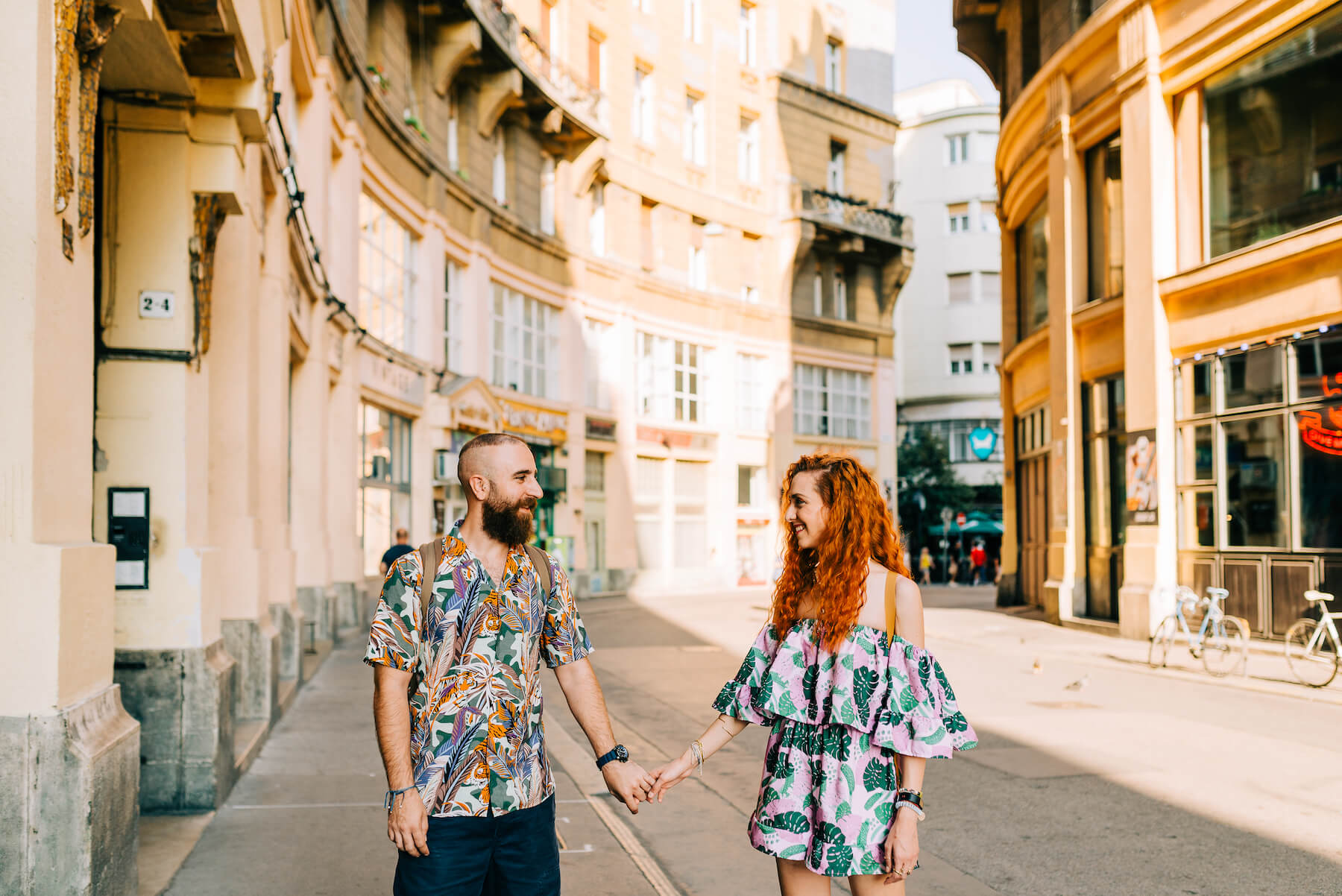 couple holding hands in the street in Budapest, Hungary
