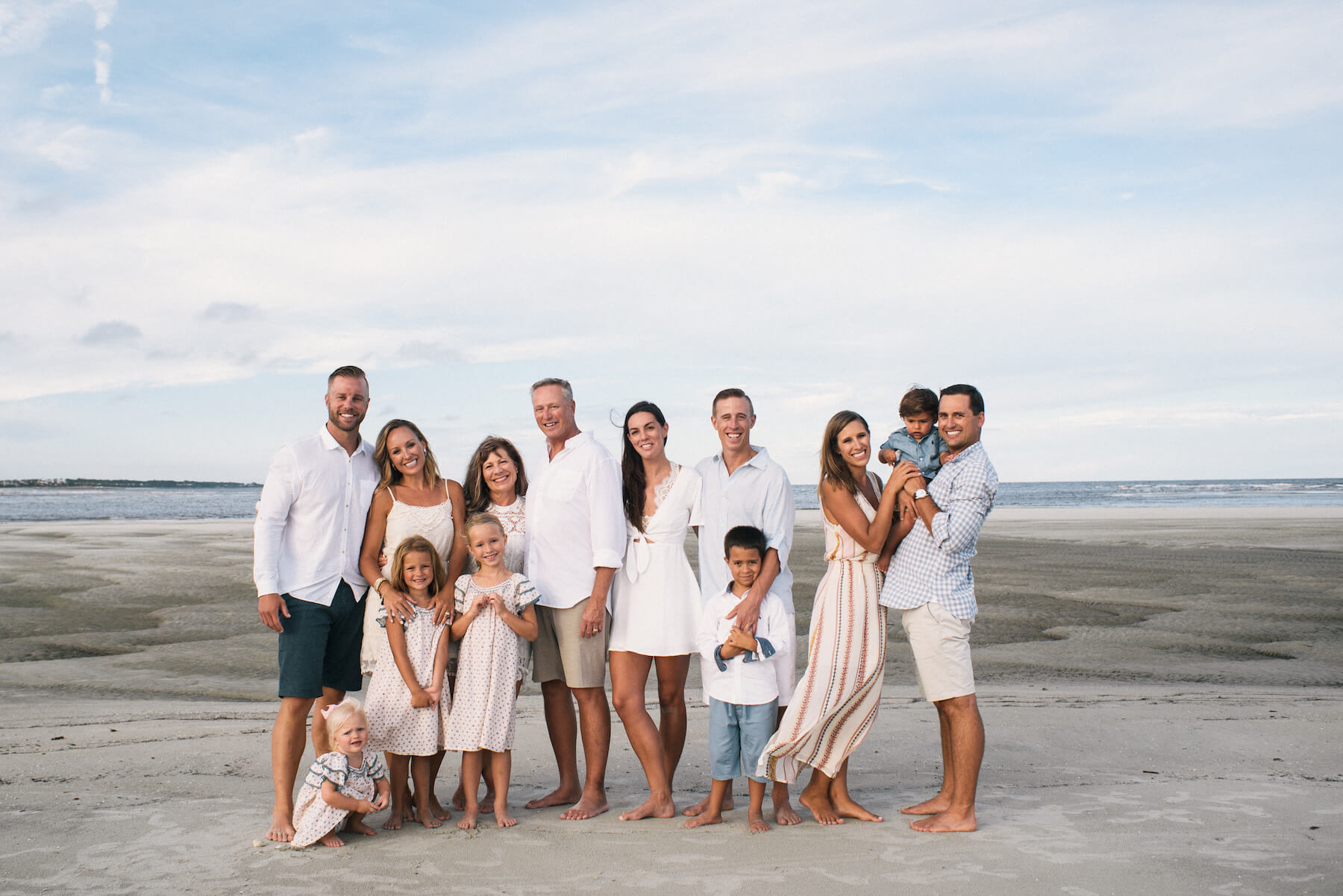a multigenerational family standing on the beach Savannah, Georgia, United States of America