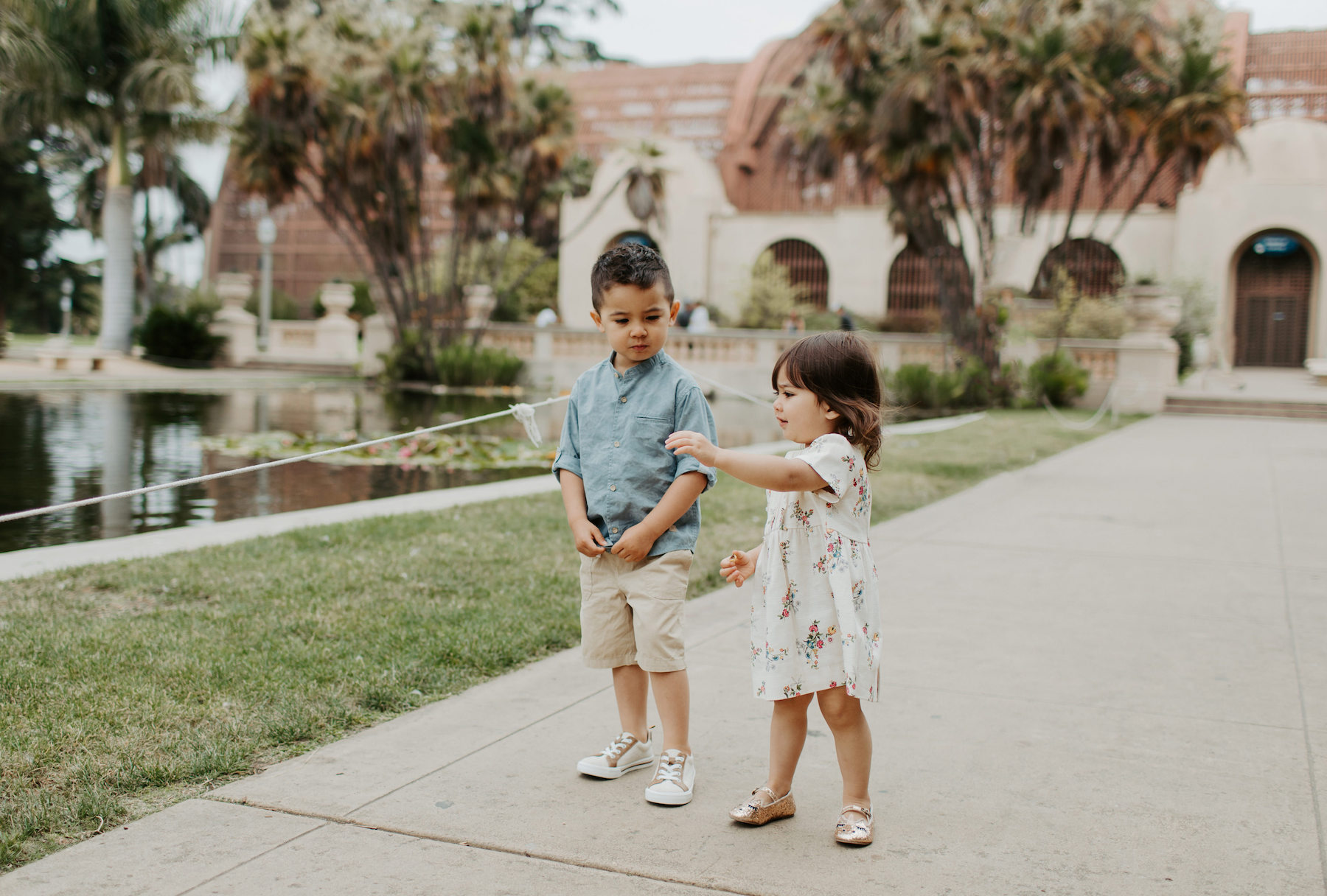 two young children standing in Balboa Park in San Diego, California