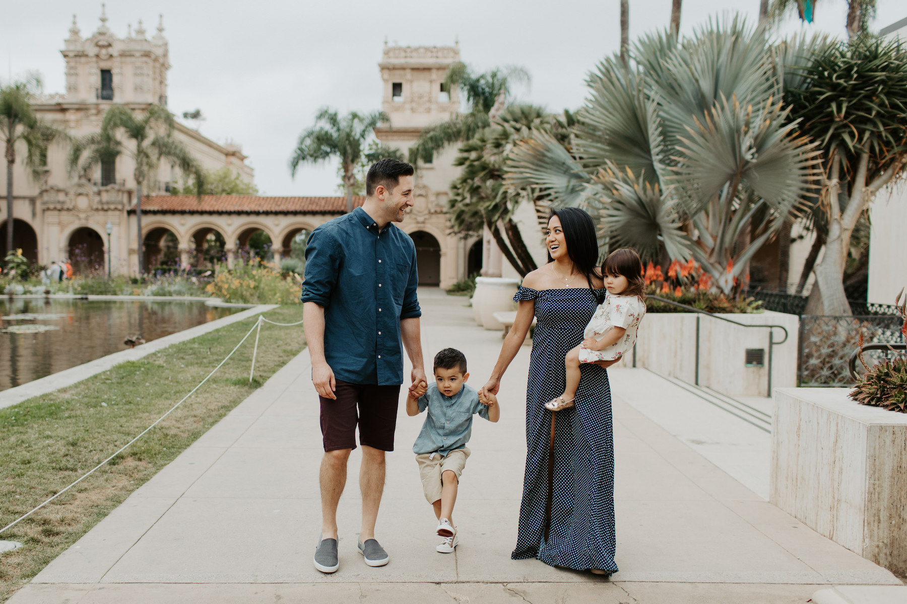  a family with two kids walking in Balboa Park San Diego, California