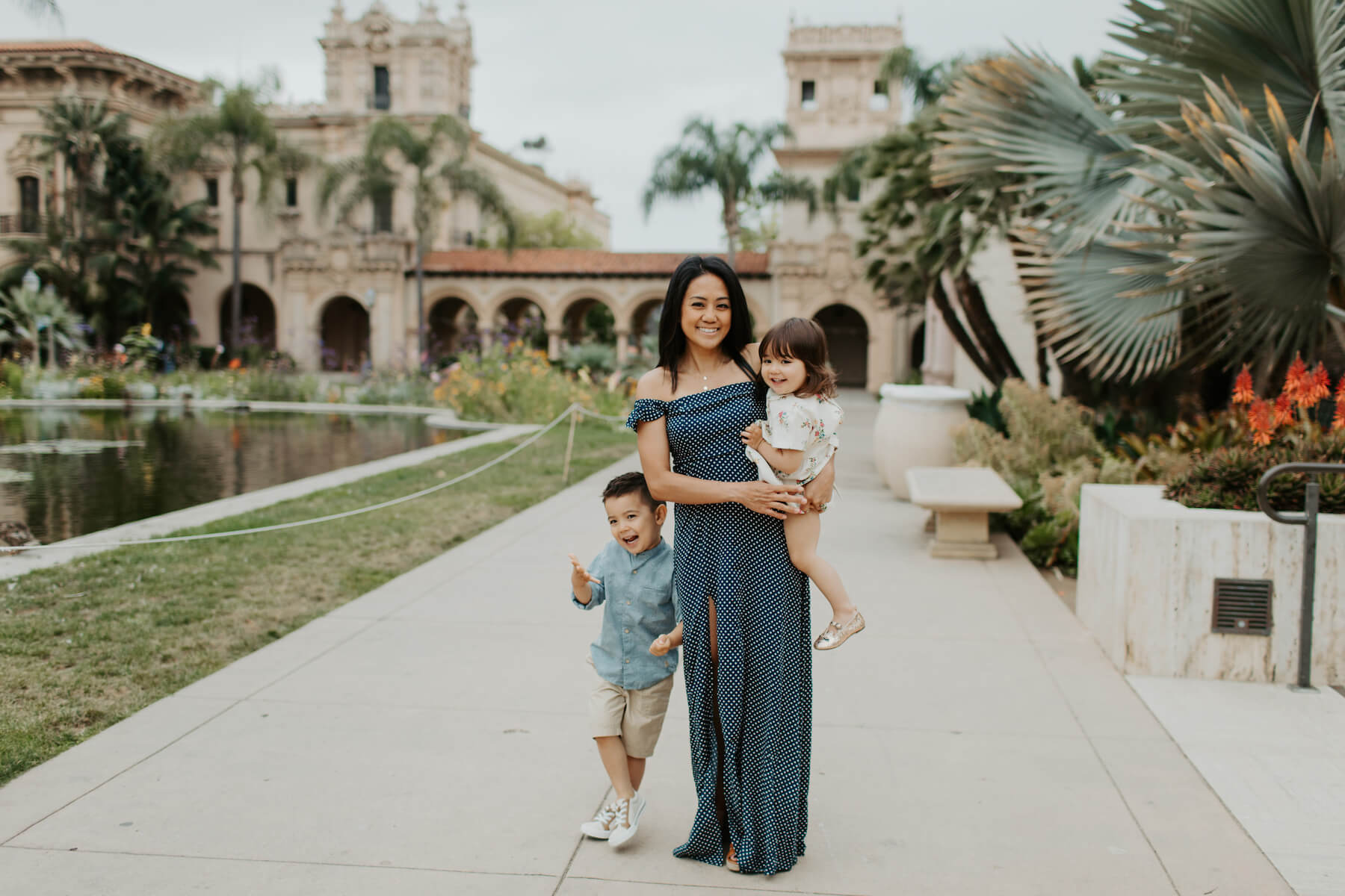 mother with her two children walking in Balboa Park San Diego, California