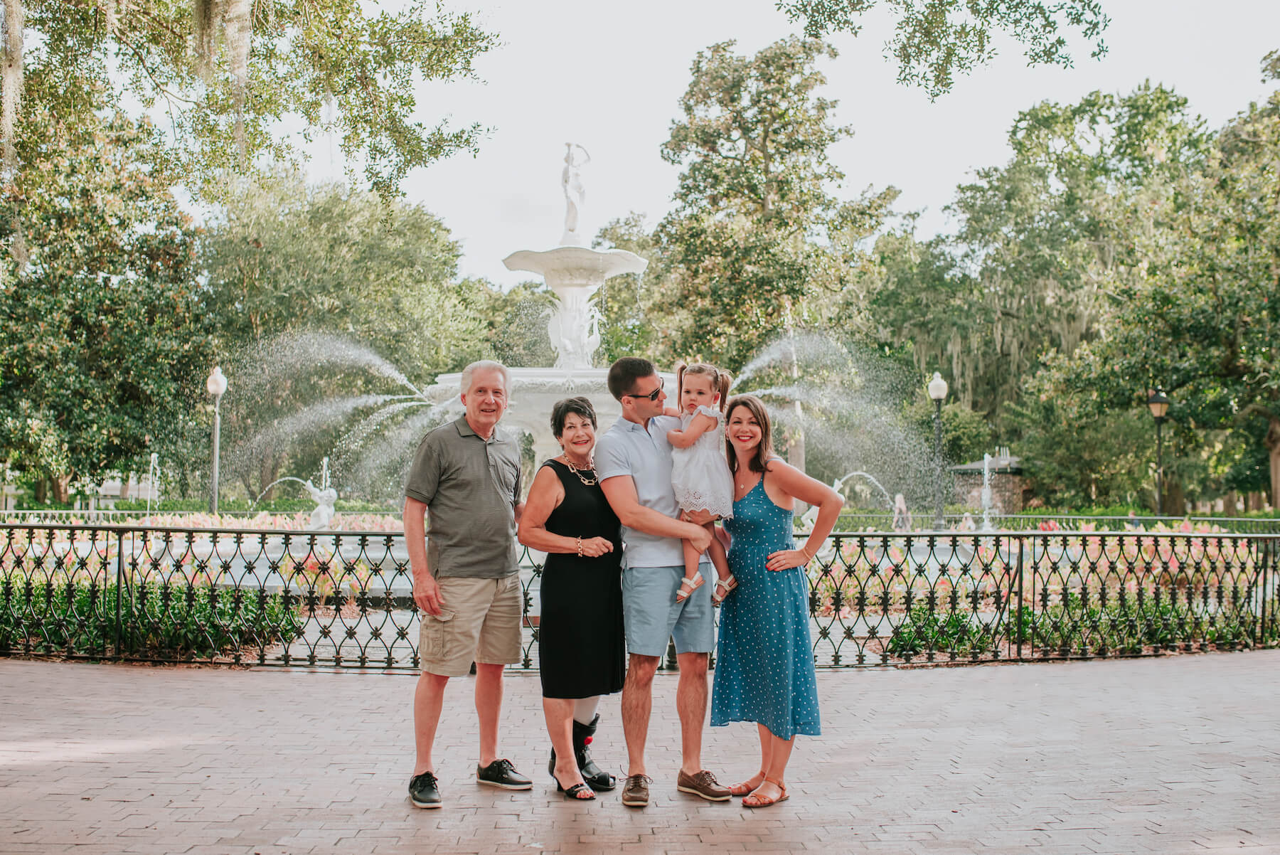 multigenerational family standing in front of the fountain in Savannah, Georgia, United States of America