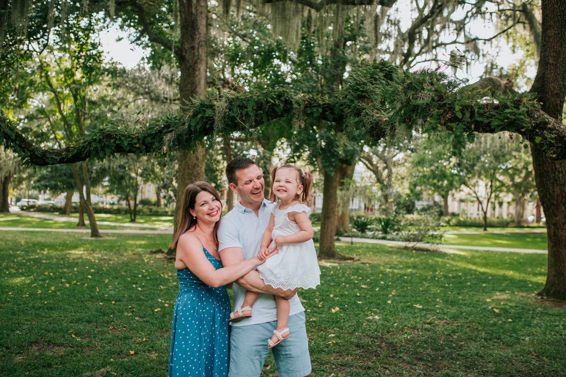 a family of three in a park in Savannah, Georgia, United States of America