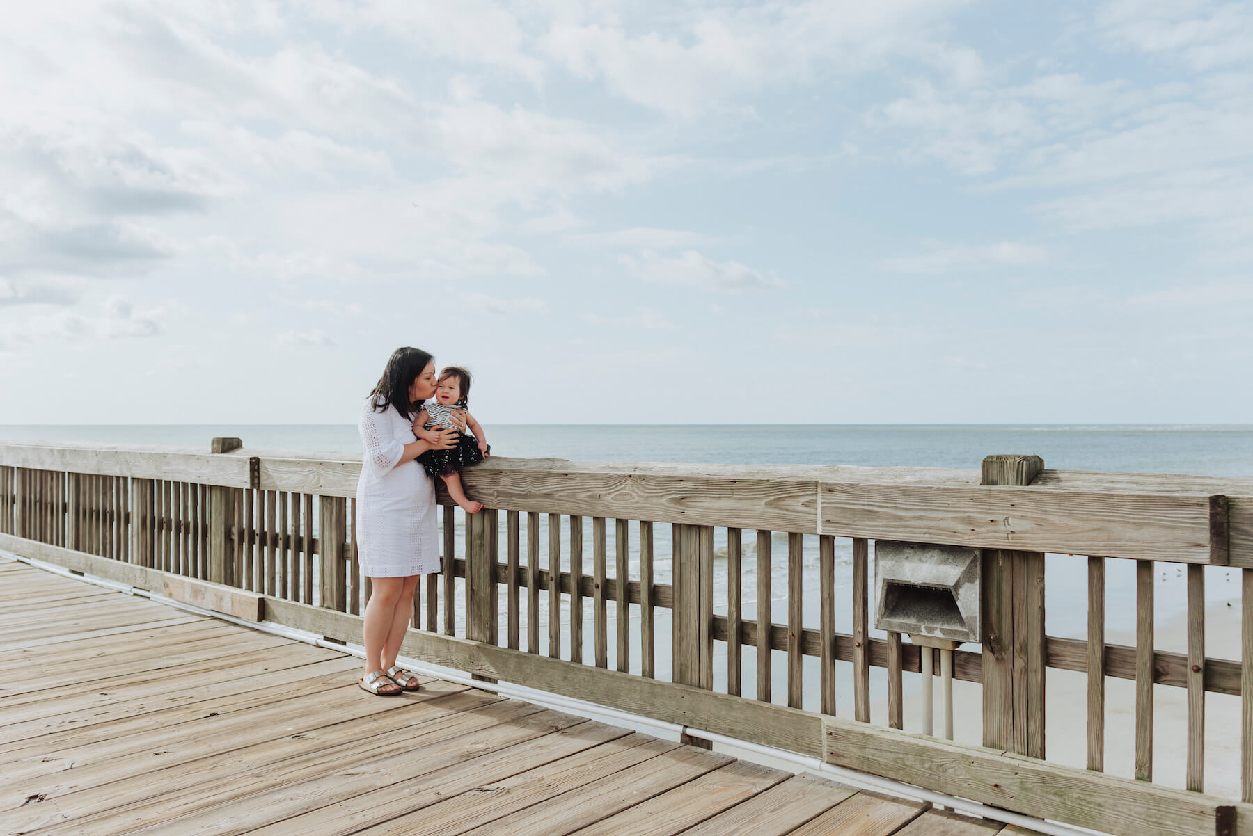 mother and infant daughter on a pier in Savannah, Georgia, United States of America