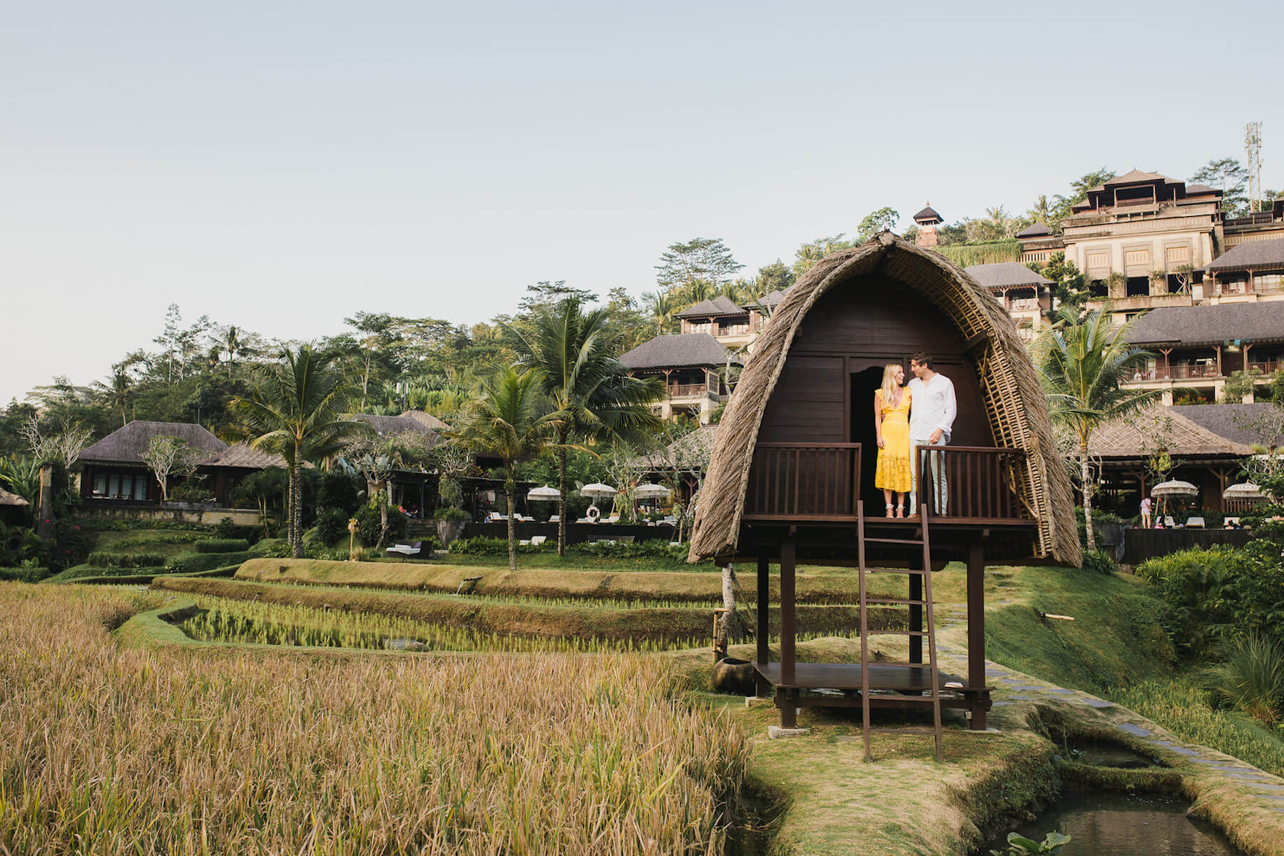 couple in Bali looking at each other and standing in a hut in Bali, Indonesia