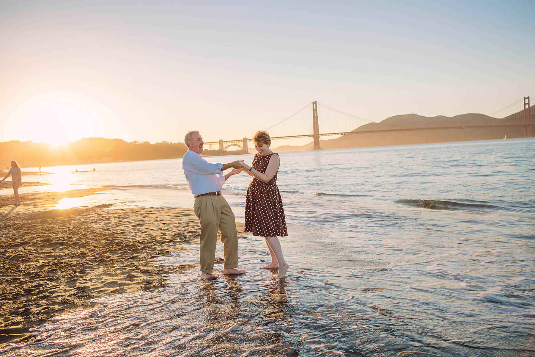 older couple dancing on the beach in San Francisco, California