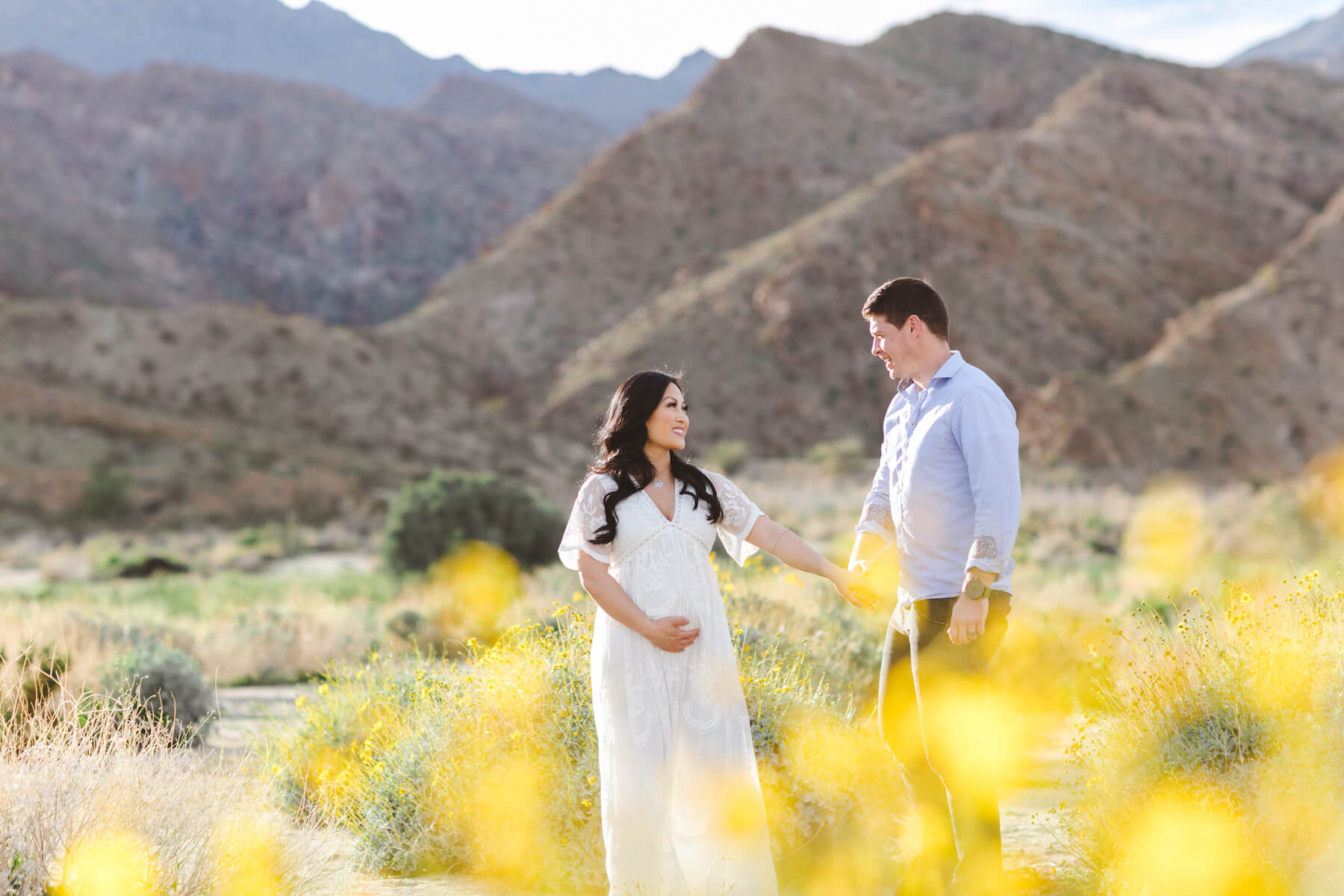 couple standing and holding each other in the desert in Palm Springs, California